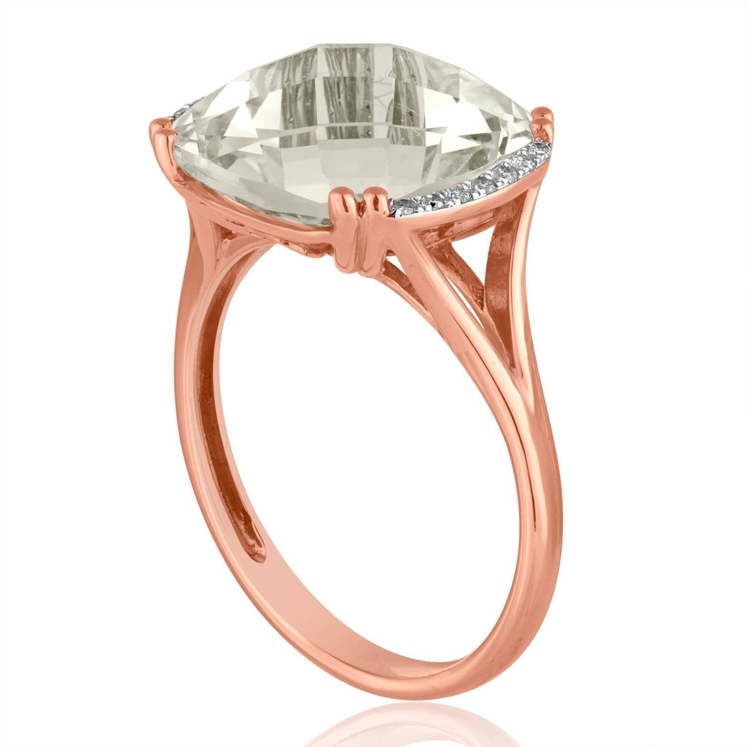 Stunning White Topaz Ring
The ring is 14K Rose Gold
There are 0.06 Carats in Diamonds H SI
The center stone is a Cushion Cut White Topaz 7.56 Carats
The top measures 10/16