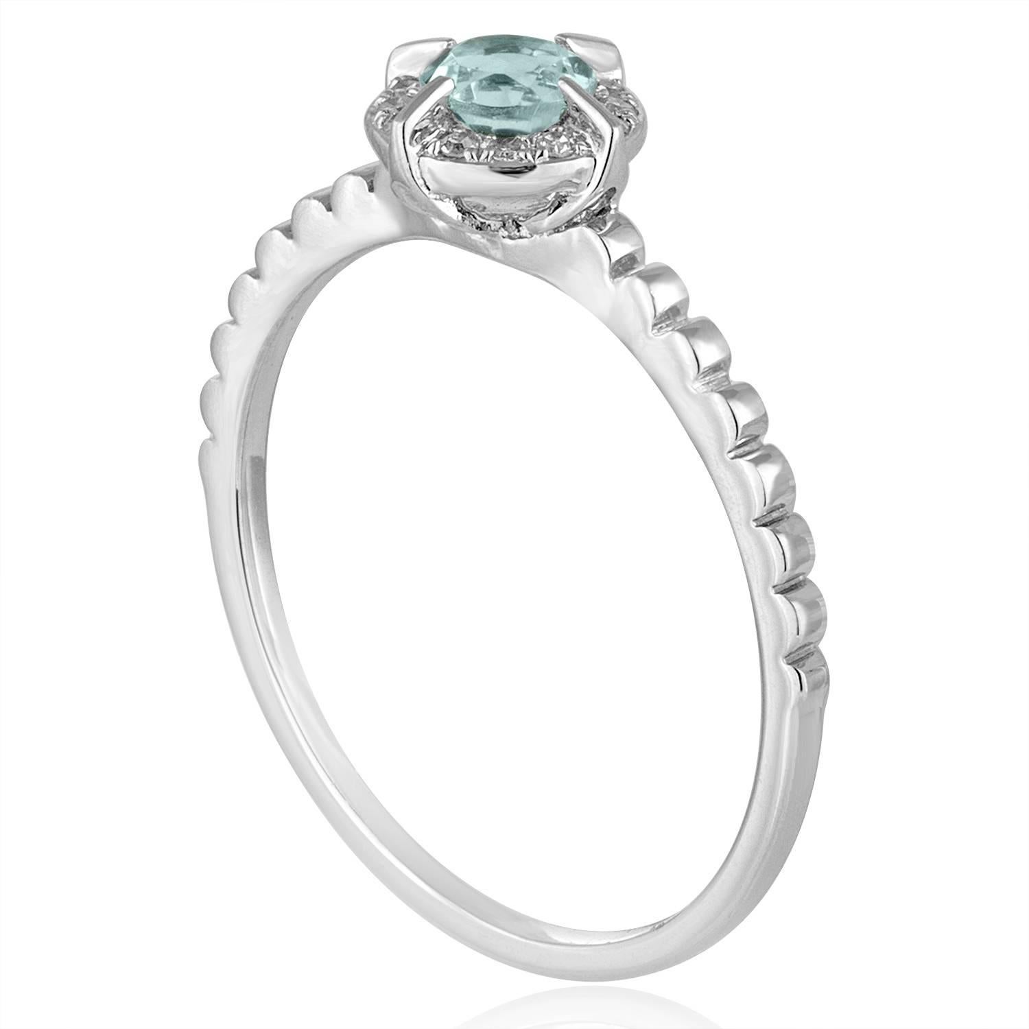 Stackable Blue Topaz Ring
The ring is 14K White Gold
There are 0.04 Carats In Diamonds H SI
The Center Stone is Round 0.34 Carats Blue Topaz
The top measures 1/4