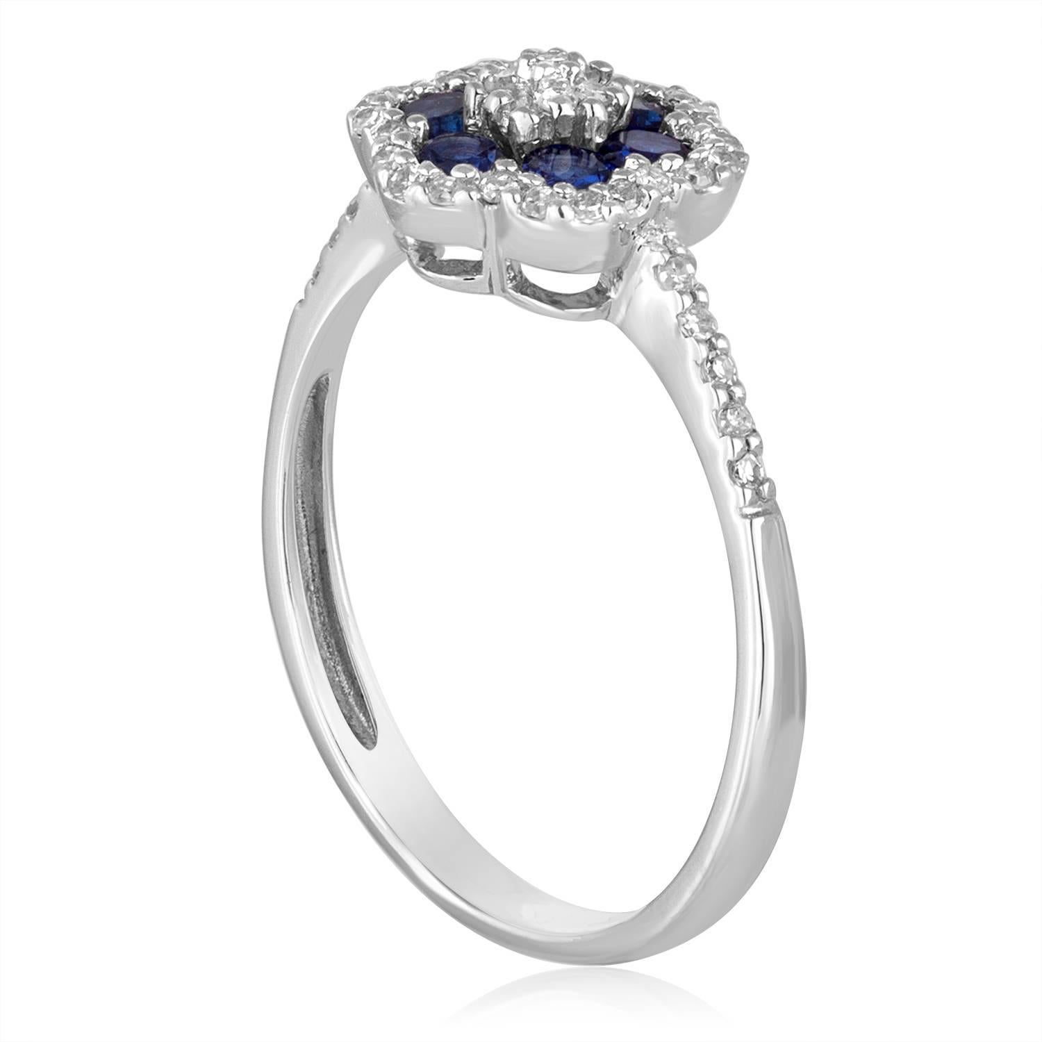 Delicate Flower Ring
The ring is 14K White Gold
There are 0.18 Carats In Diamonds G/H SI
There are 0.58 Carats in Blue Corundum (Lab-Created)
The top of the ring measures 6/16