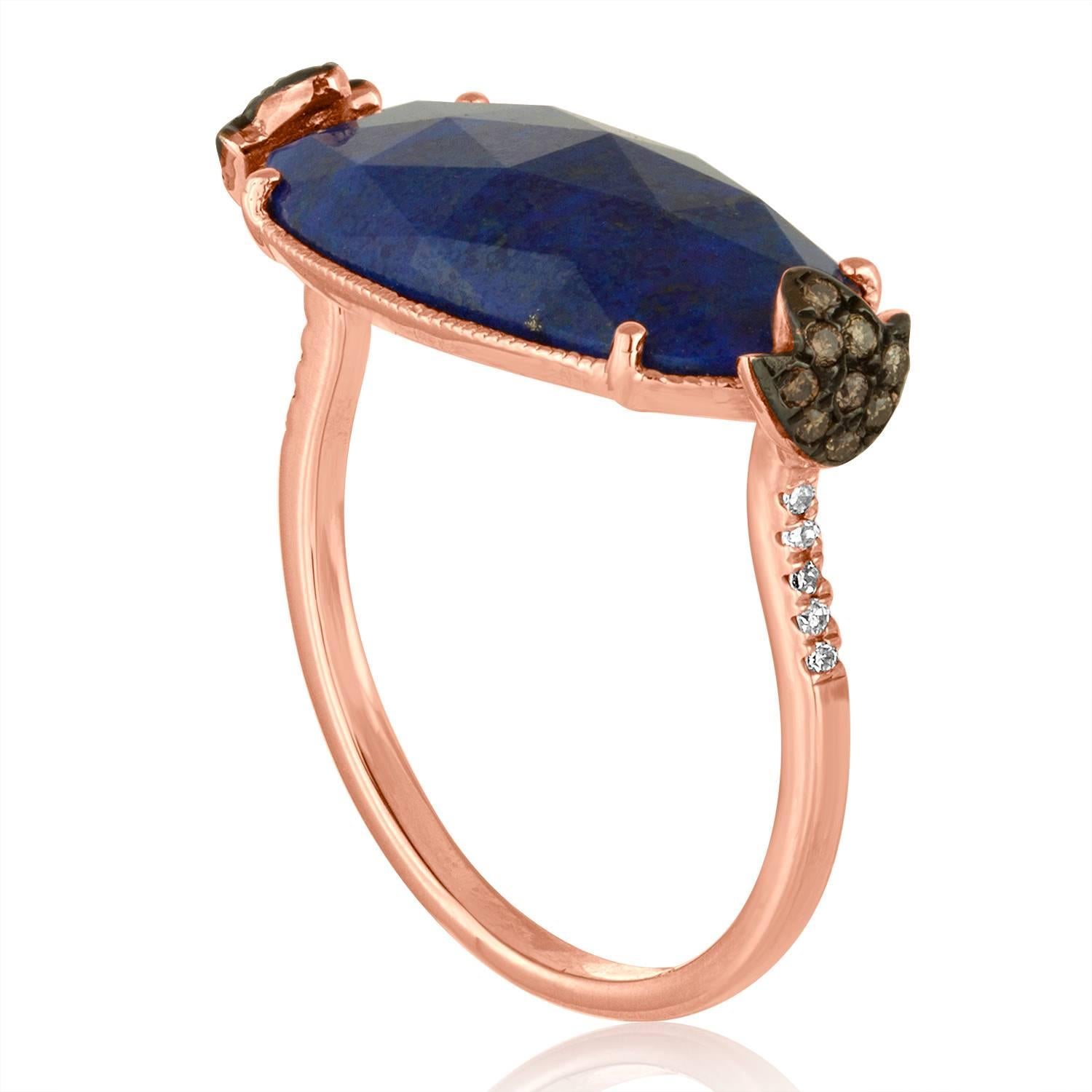 Beautiful and Fun Ring
The ring is 14K Rose Gold
There are 0.03 Carats In White Diamonds J/K SI
There are 0.09 Carats In Brown / Champagne Diamonds SI
The Center Stone is a Faceted Cabochon Lapis Lazuli 4.32 Carats
The ring measures on top 14/16