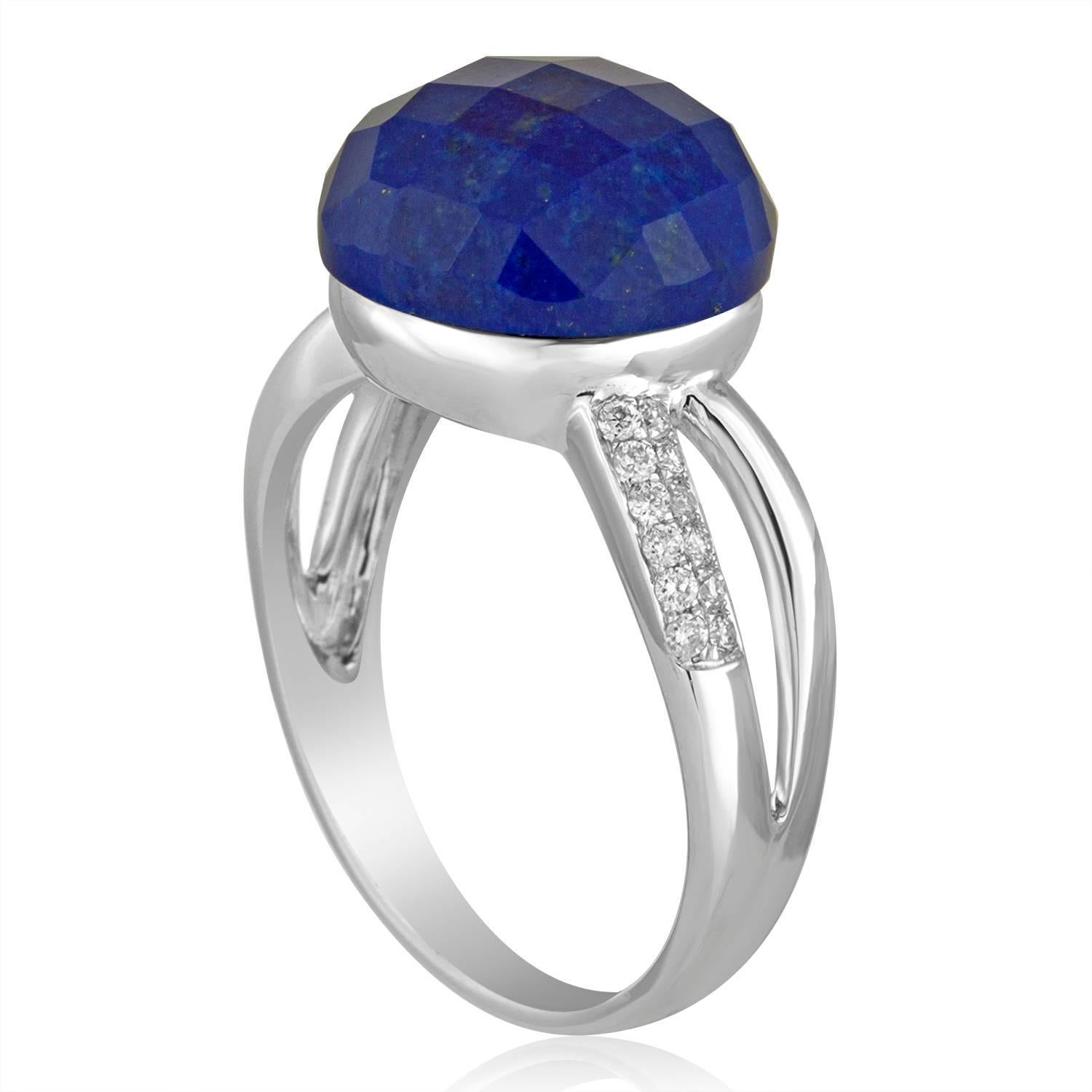 Beautifully Ring
The ring is 14K White Gold
There are 0.14 Carats In Diamonds G/H SI
The Center Stone is a Round Faceted Cabochon Lapis Lazuli 7.37 Carats
The ring measures on top 7/16