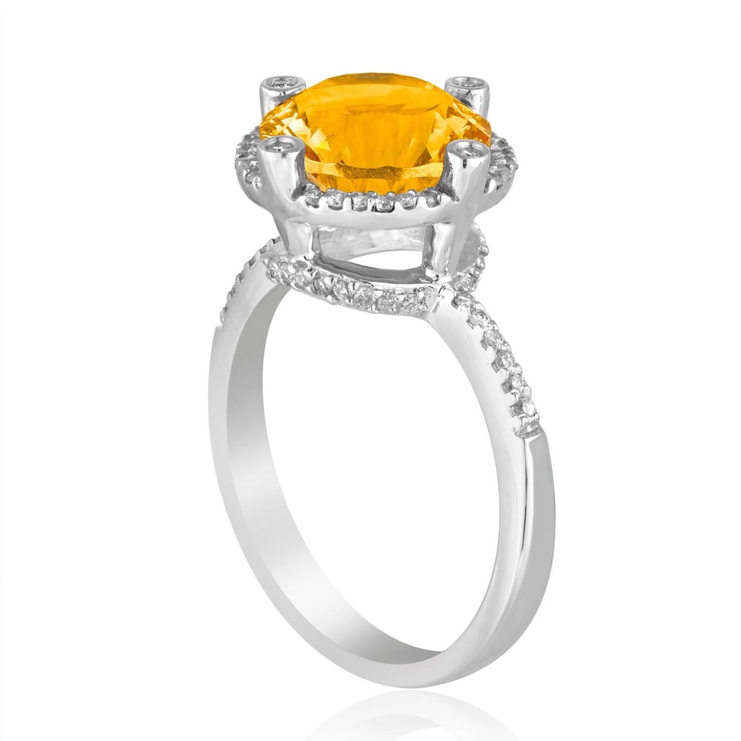Stunning Citrine Ring
The ring is 14K White Gold
There are 0.27 Carats In Diamonds H/I I1
The Round Citrine is a Millennium Cut 3.11 Carats
The top measures 1/2