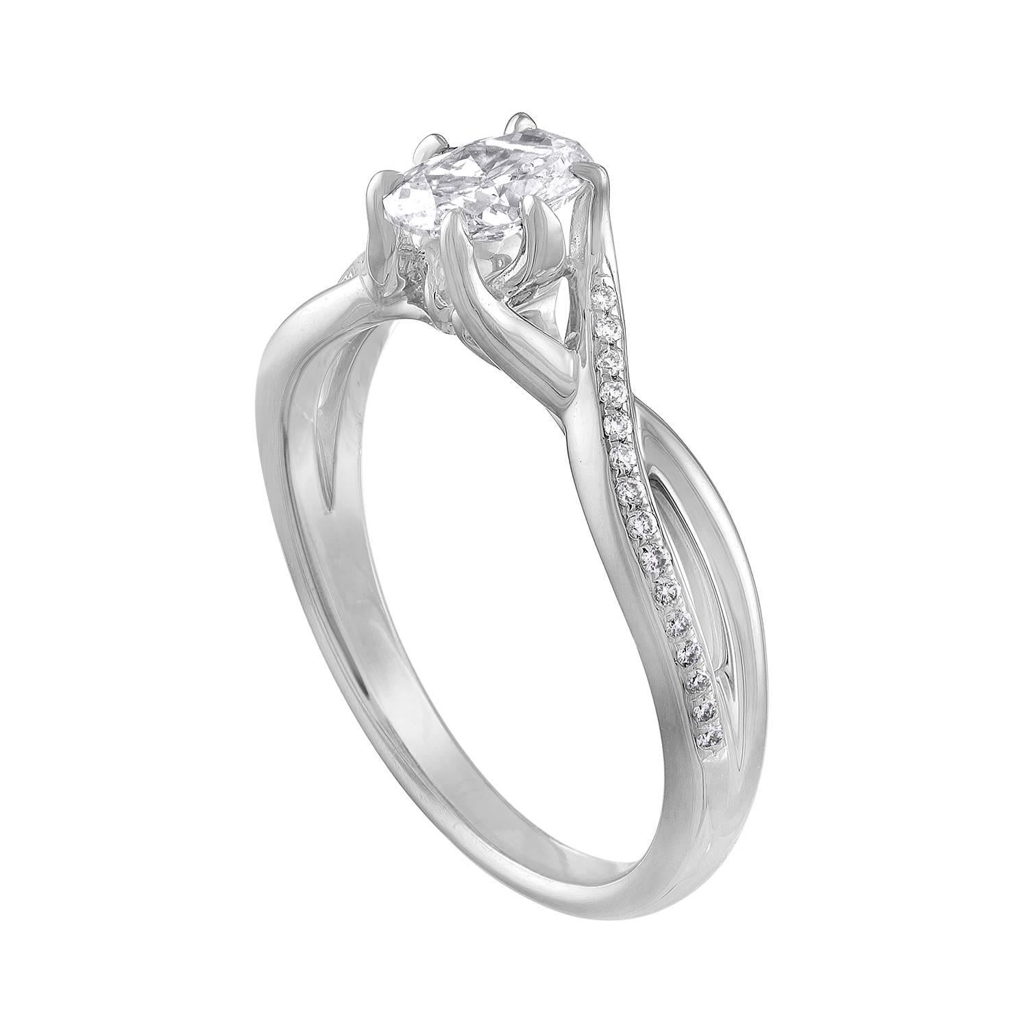 Stunning Engagement Ring With Crisscross Split Shank.
The ring is 14K White Gold.
The center Diamond Stone is an Oval Cut 0.52 Carats I VVS.
There are 0.25 Carats in small round diamonds F VS.
The total weight of all diamonds is 0.77 Carats.
The