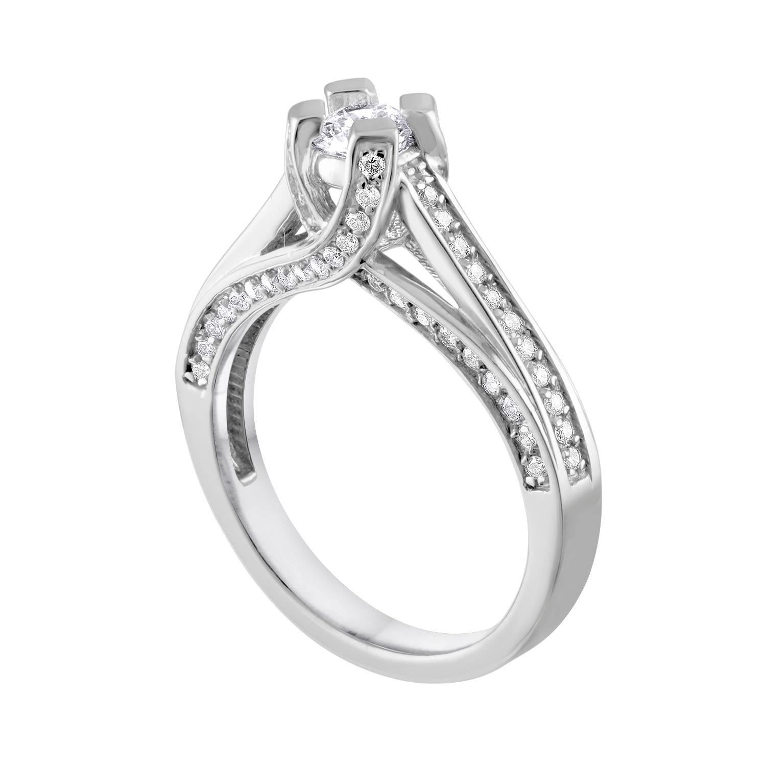 Stunning Engagement Ring With Crisscross.
The ring is 14K White Gold.
The center Diamond Stone is a Round Cut 0.35 Carats H SI.
There are 0.50 Carats in small round diamonds G/H SI.
The total weight of all diamonds is 0.85 Carats.
The ring is a size