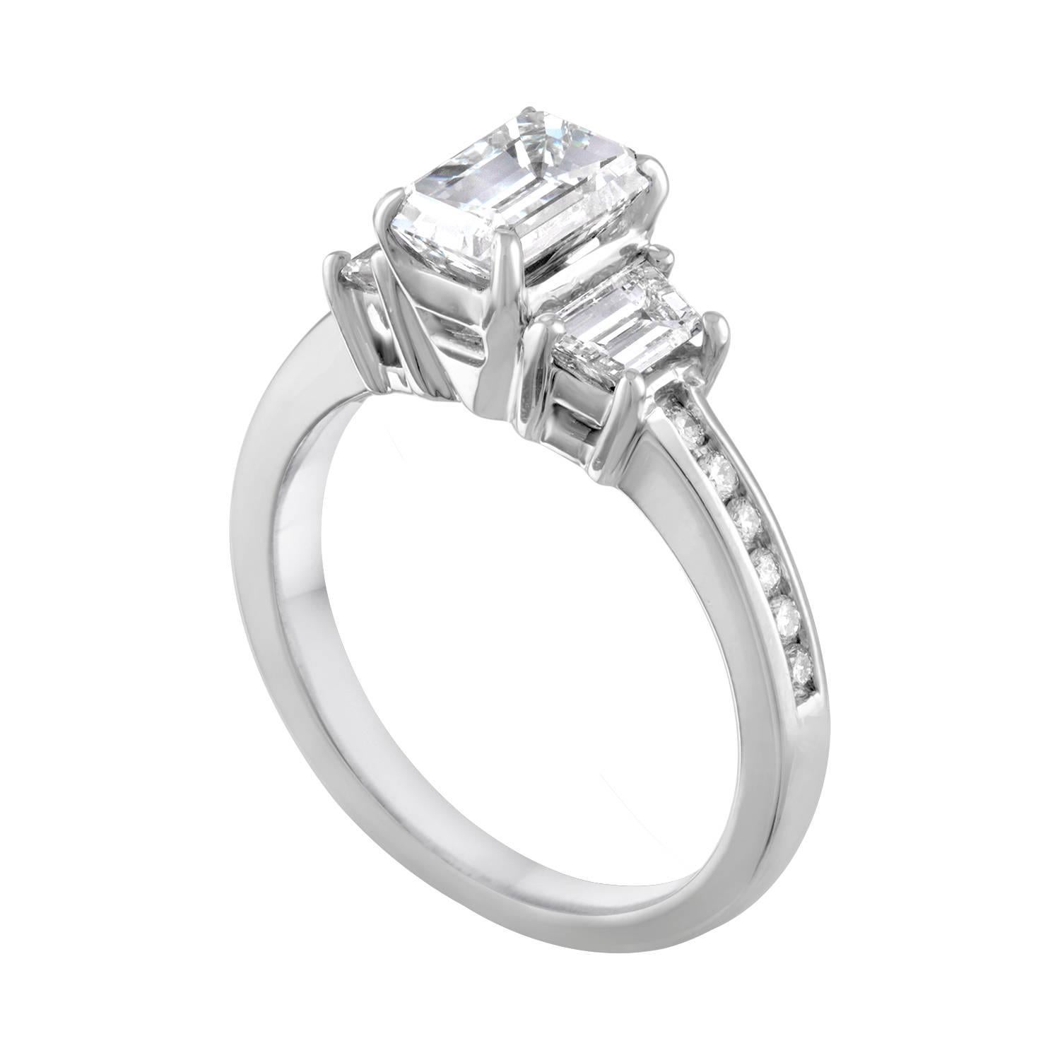 3-Stone Diamond Ring.
The ring is 14K White Gold.
The center stone in an Emerald Cut Diamond.
The center stone is GIA Certified Diamond 1.16 Carats G VVS2.
The 2 side stones are Trapezoids Diamonds 0.50 Carats G VS.
There are 0.20 Carats in Small