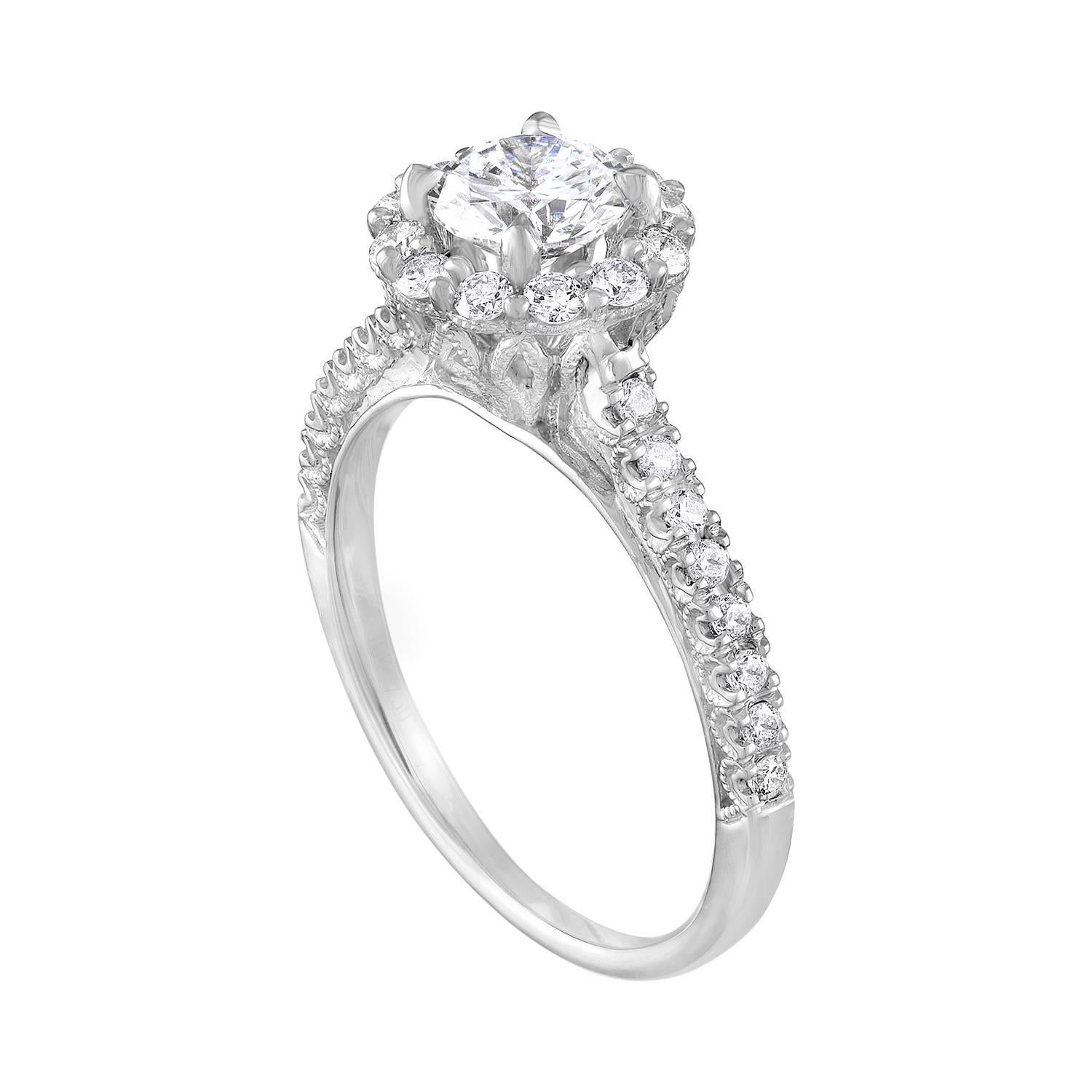 The ring is 18K White Gold, Milgrain Design.
The center stone is a Round 0.80 Carats E VVS1 GIA Certified.
The setting has 0.45 Carats in White Diamonds G/H SI.
The ring is a size 7.25, sizable.
The ring weighs 3.9 grams.