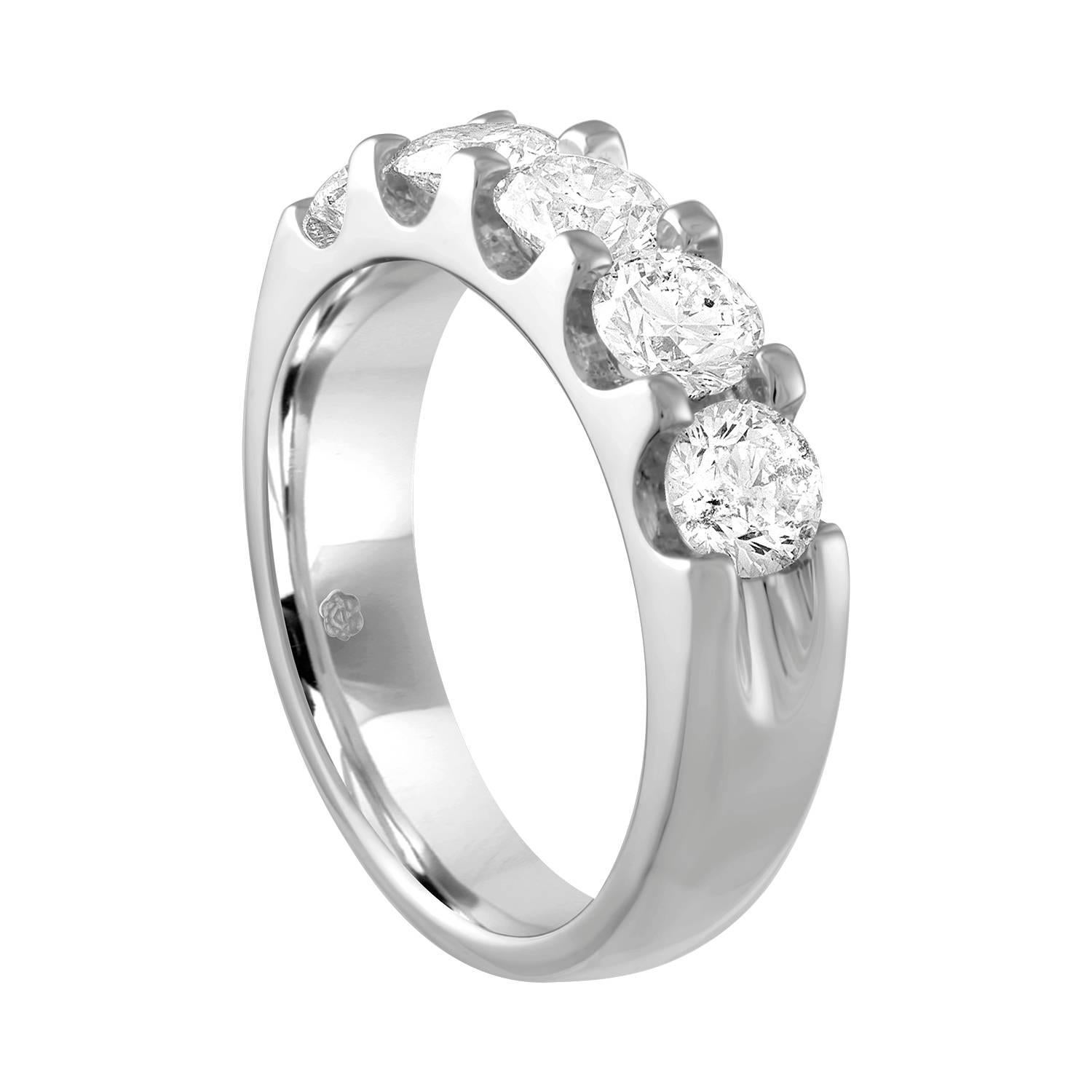 Very Beautiful Half Diamond Band Ring.
The ring is 18K White Gold.
There are 5 Round Cut Diamonds prong set.
There are 2.00 Carats In Diamonds E/F SI.
The ring is a size 7, sizable. 
The band is 5.37 mm wide and tapers down to 4.29 mm.
The ring