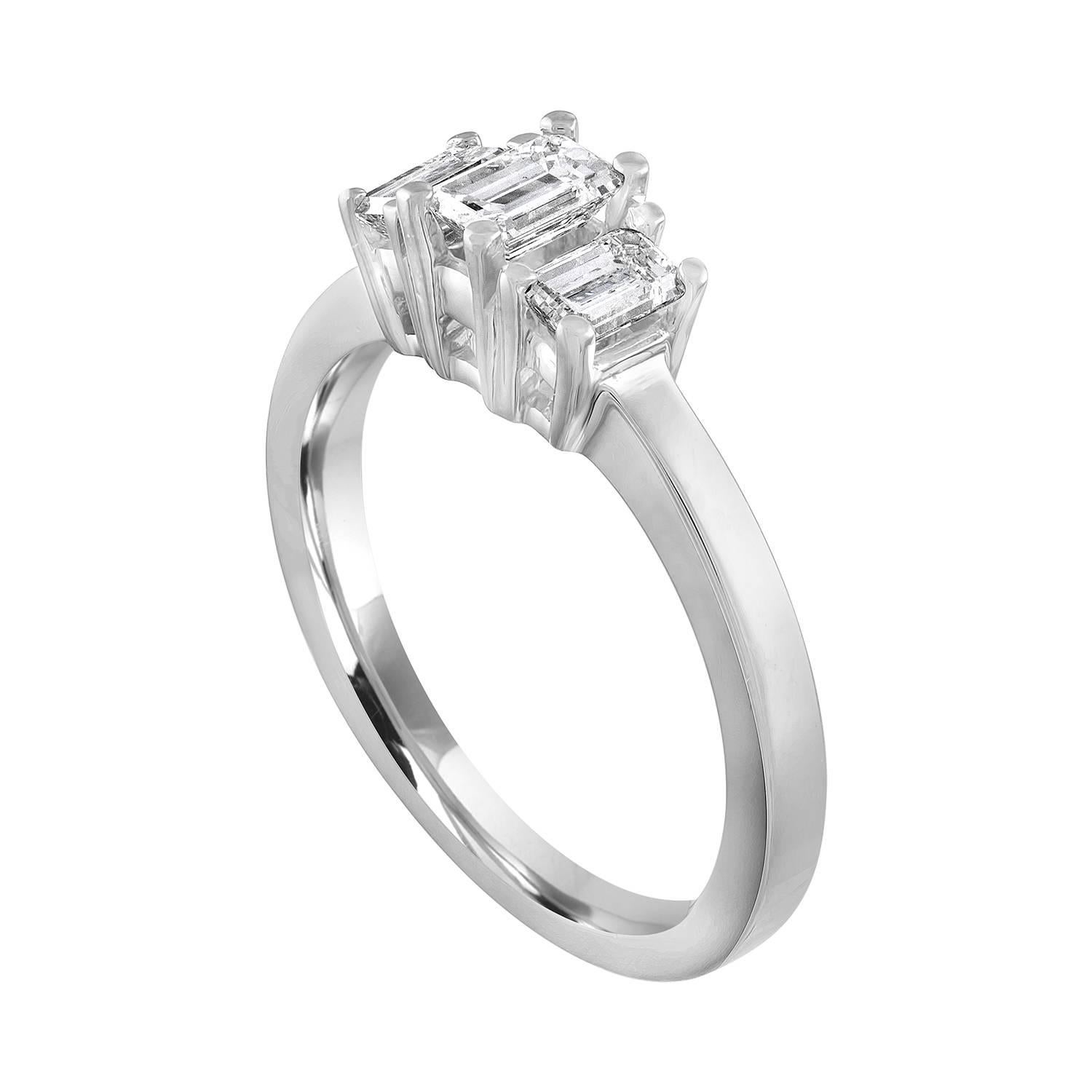This a delicate three-stone ring.
The ring is Platinum 950.
The 3 Diamonds are Emerald Cut.
The Center stone is 0.50 Carats F VVS.
The 2 Side stones are 0.40 Carats Total Weight F VVS.
All 3 diamonds total 0.90 Carats.
The ring weighs 6.0 grams.
The