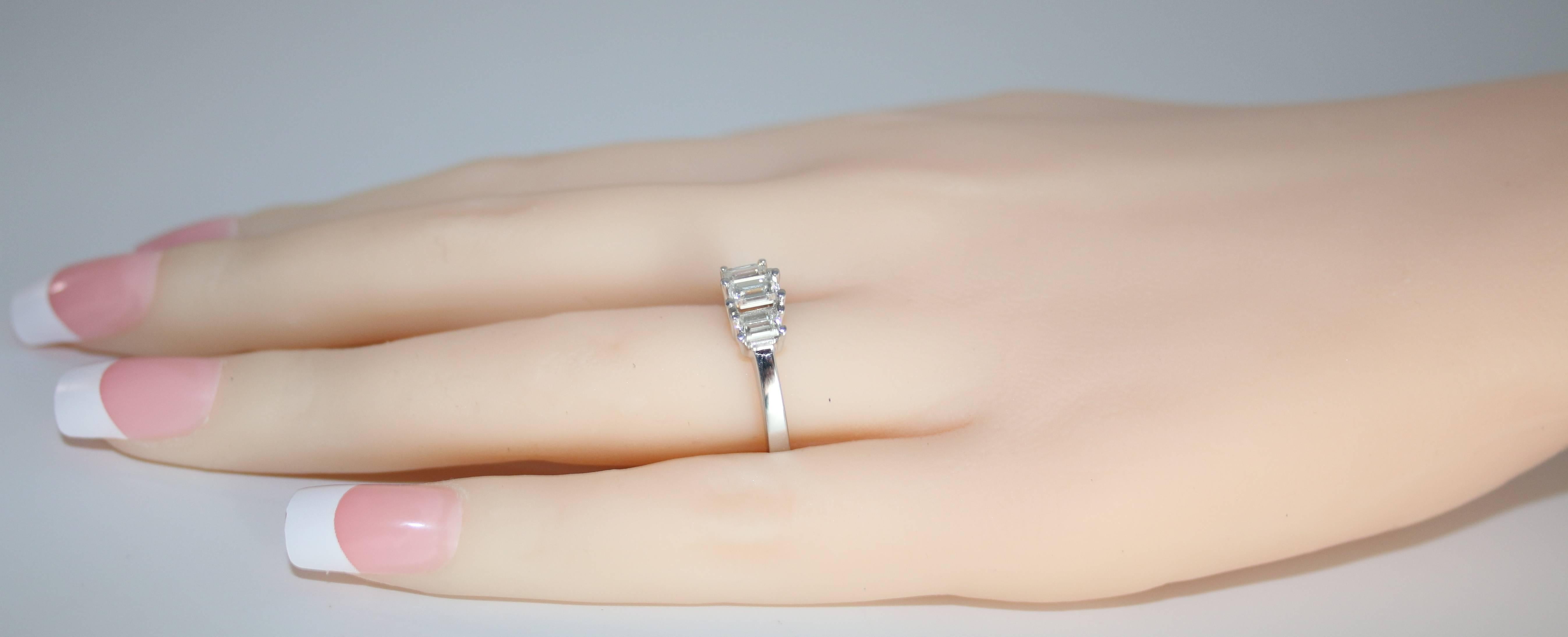 emerald cut diamond ring with emerald side stones