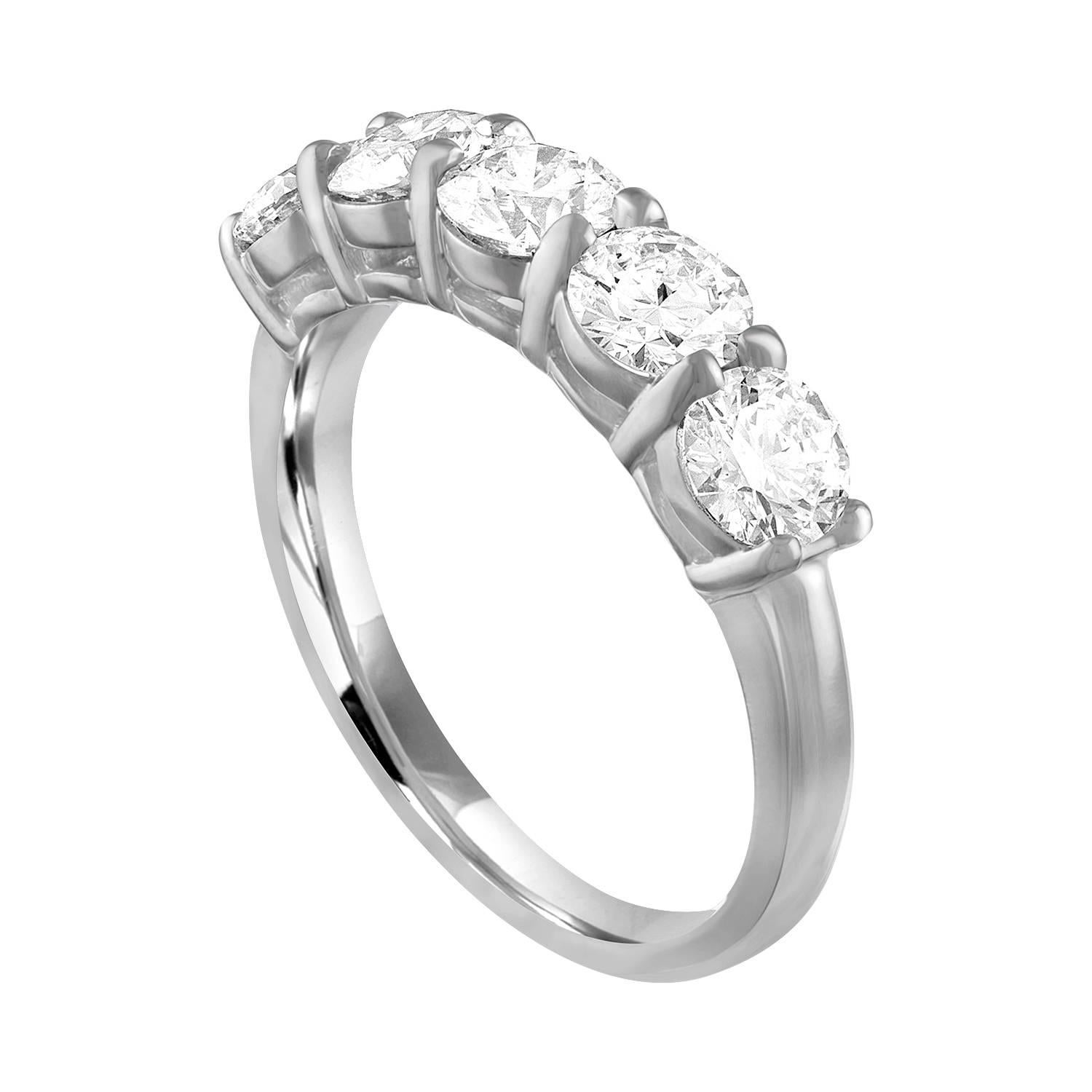 Very Beautiful Half Diamond Band Ring.
The ring is 14K White Gold.
There are 5 Round Cut Diamonds prong set.
There are 1.75 Carats In Diamonds H/I VS.
The ring is a size 6.75, sizable. 
The band is 4.59 mm wide and tapers down to 2.13 mm.
The ring