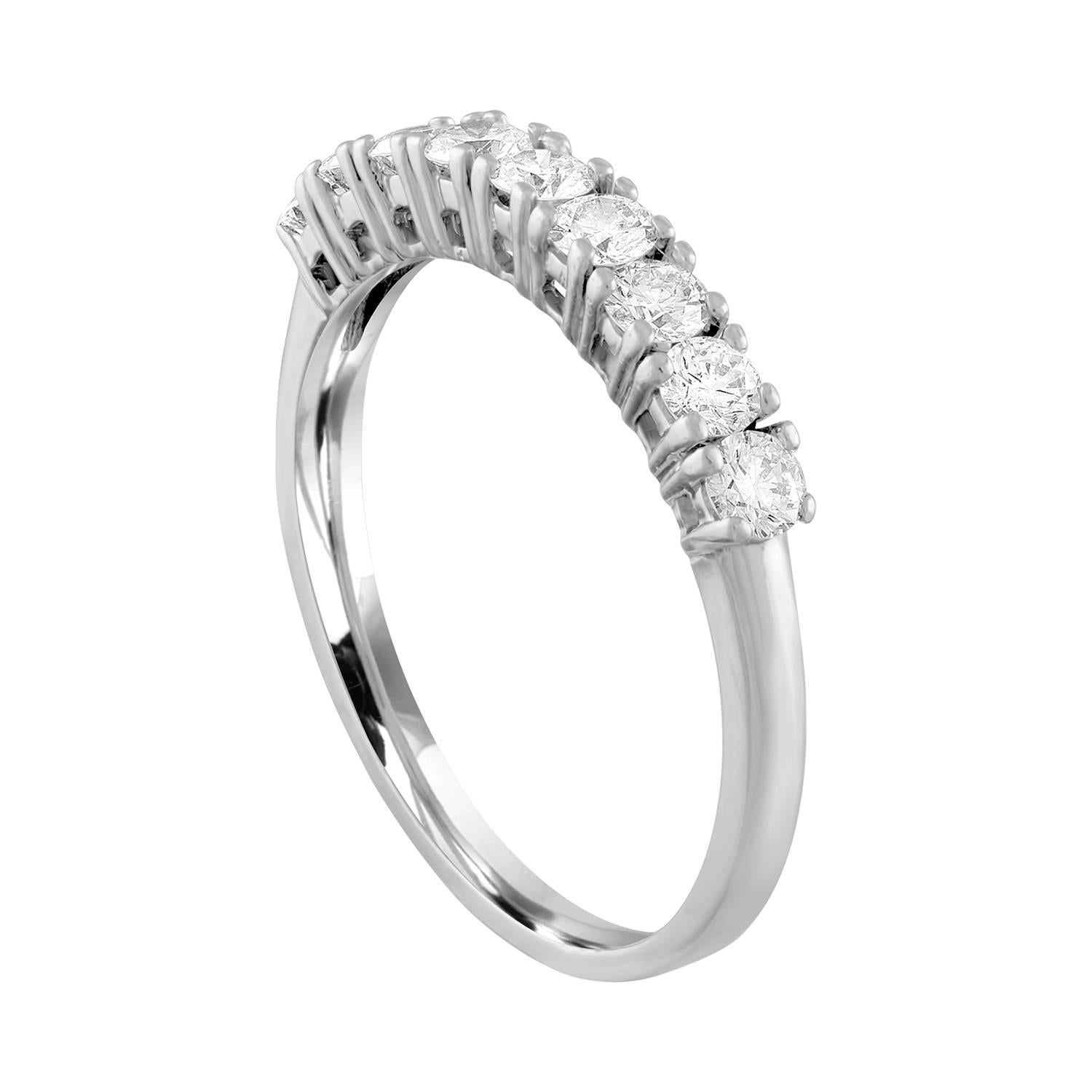 Very Beautiful Half Diamond Band Ring.
The ring is 14K White Gold.
There are 9 Round Cut Diamonds prong set.
There are 0.90 Carats In Diamonds G/H SI.
The ring is a size 9.5, sizable. 
The band is 3.30 mm wide and tapers down to 2.03 mm.
The ring