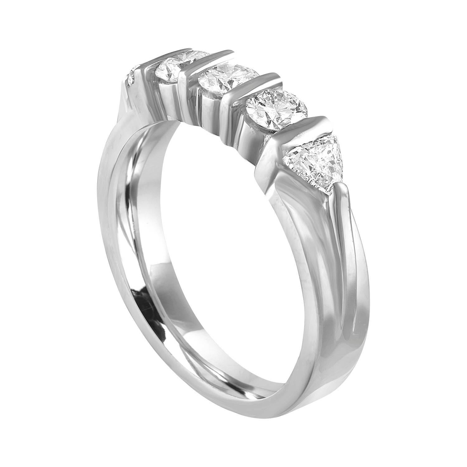 Very Beautiful Half Diamond Band Ring.
The ring is Platinum 950.
There are 3 Round Cut Diamonds.
There are 2 Trillion Cut Diamonds.
There are 0.80 Carats In Diamonds G/H VS.
The ring is a size 6.00, sizable.
The band is 4.47 mm wide and tapers down