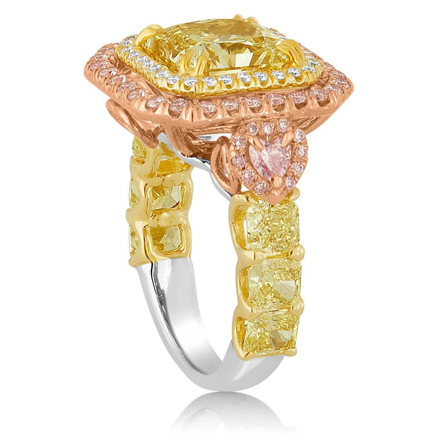 Absolutely Stunning, hand made, one of a kind Diamond Ring.
The huge center stone is  4.02ct GIA certified Fancy Yellow Diamond.
There are 0.75ct in Fancy Pink Diamonds
Each side has 3 Fancy Yellow Radiant Cut Diamonds.
There are 6 stones in