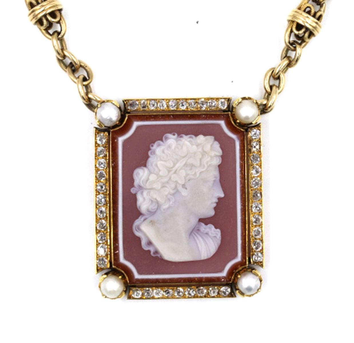This antique cameo pendant features 40 Old European Cut Diamonds which equal approximately 2 carat total weight. This necklace was purchased from the customer in this fashion, as a marriage of a cameo pendant and old watch chain. The pendant is from