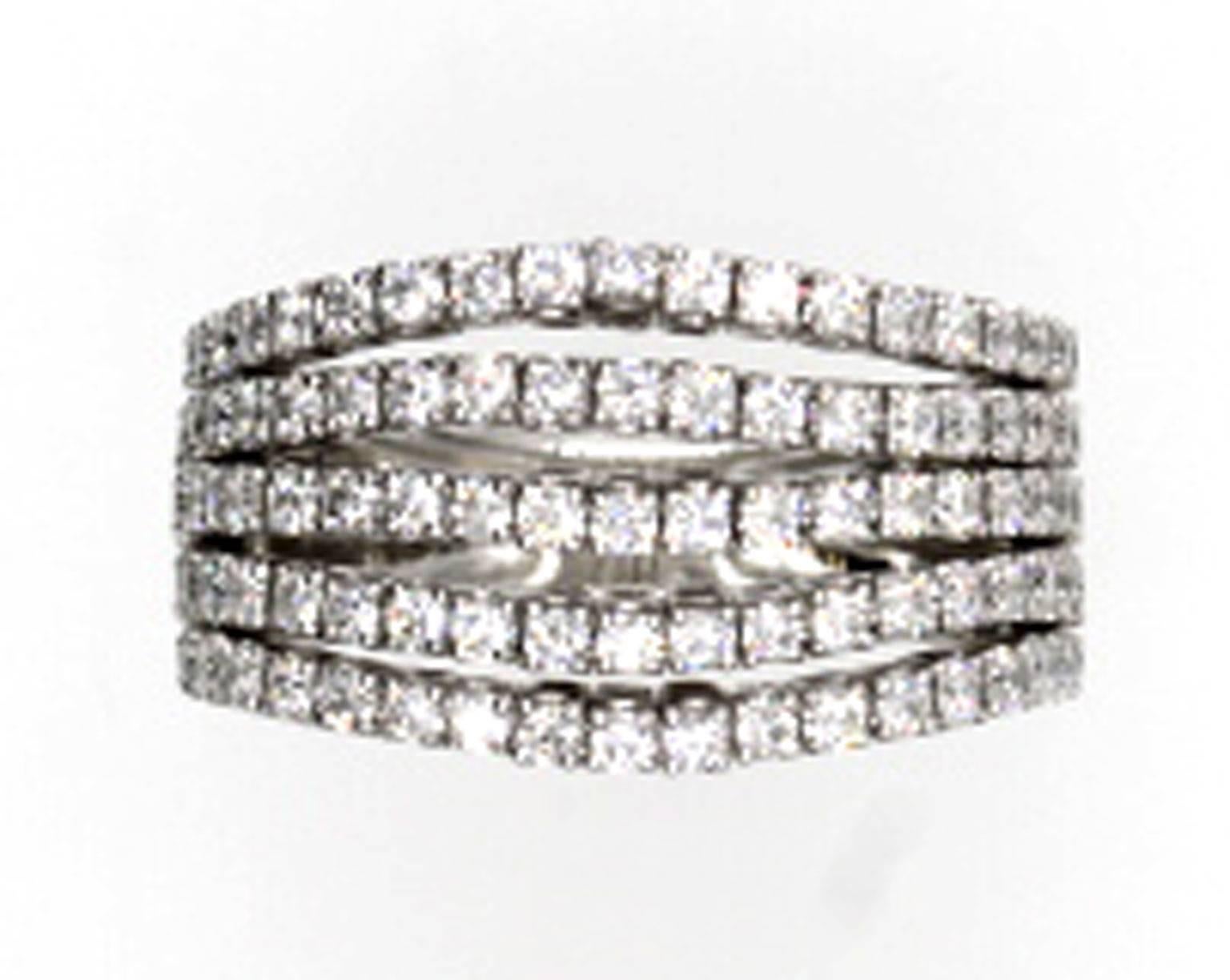 This fashionable diamond ring features five flexible rows of diamonds set in 18-karat white gold. The diamond rows are not connected in the front so they can move freely, but the ring is connected and solid in the back. There are 95 round brilliant