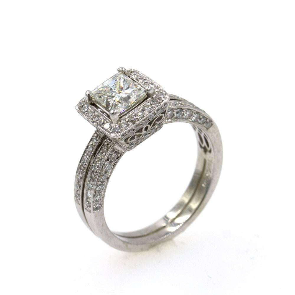 This modern diamond engagement ring will look gorgeous on any finger. The halo mounting and two row band look great with the 1.02 center princess cut diamond.  There are 0.5 carats of surrounding diamonds. The center diamond has been certified by