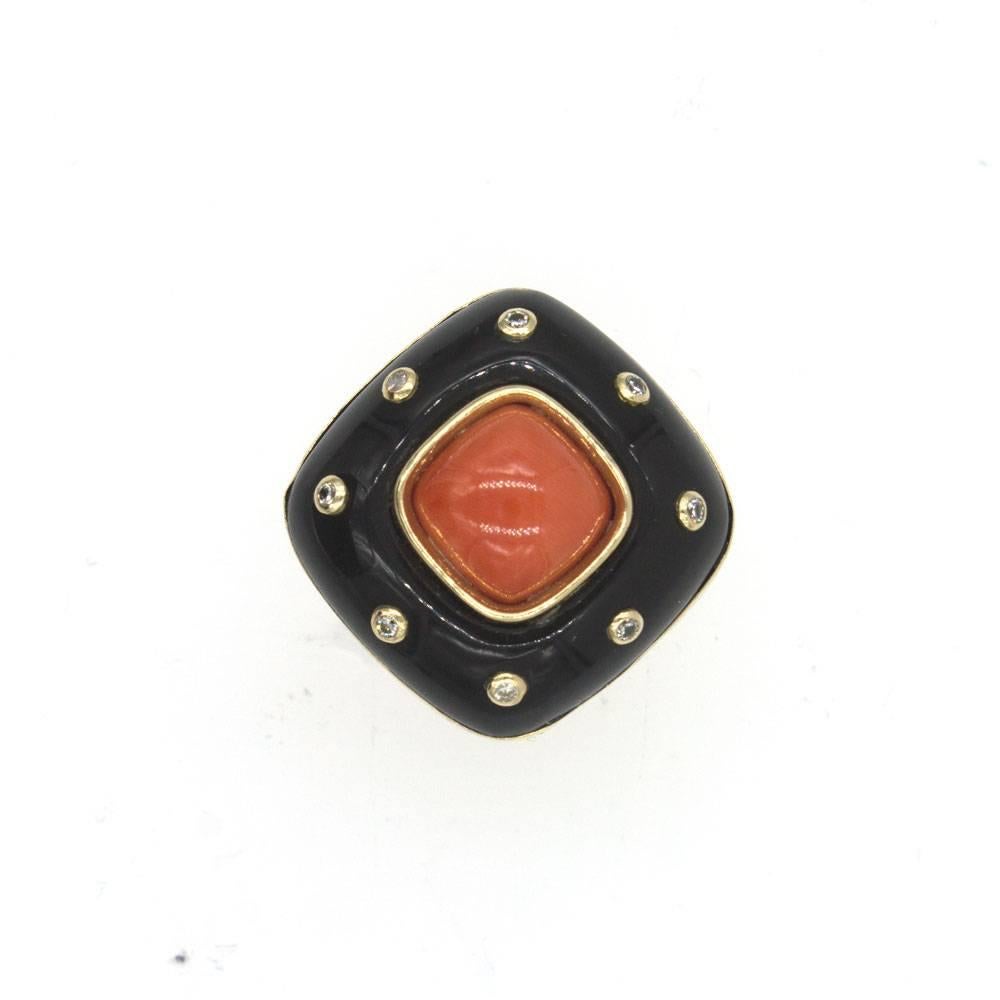 This fabulous fashion ring features a mix of coral and onyx gemstone that look great with the yellow gold accents. There are 8 round brilliant cut diamonds that are set within the onyx and surround the coral interior. The ring measures 23 x 23mm,