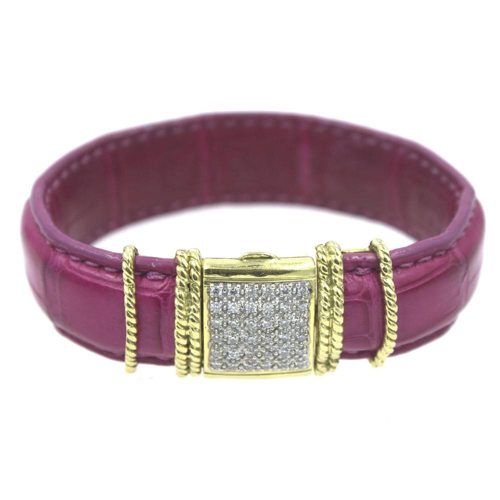 This stylish and fashionable bracelet by designer Cassis features 36 pave diamonds set in an 18 karat yellow gold hand twisted rope design. The hot pink bracelet is genuine American alligator, and measures 2.5 inches in diameter. New without
