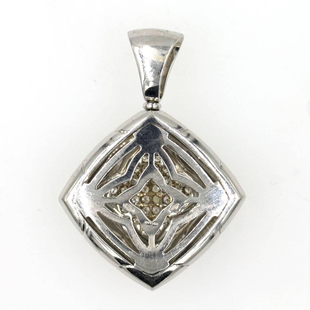 This gorgeous pendant by Bulgari features 40 diamonds in an 18 karat white gold pyramid mounting. The pendant measures 25 x 25mm, has a 45mm drop from top of the baile, is signed Bvlgari, hallmarked, and numbered 30..AL. 
The pendant would look