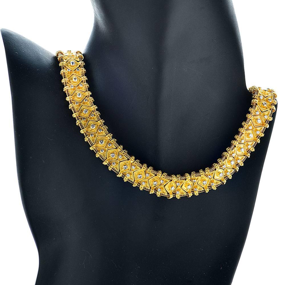 This beautifully crafted Greek Etruscan style necklace features approximately 6 carats of diamonds in florentine finished 18 karat yellow gold. The necklace is flexible, and lays perfectly on the neck. The diamonds are graded F-G color and VS