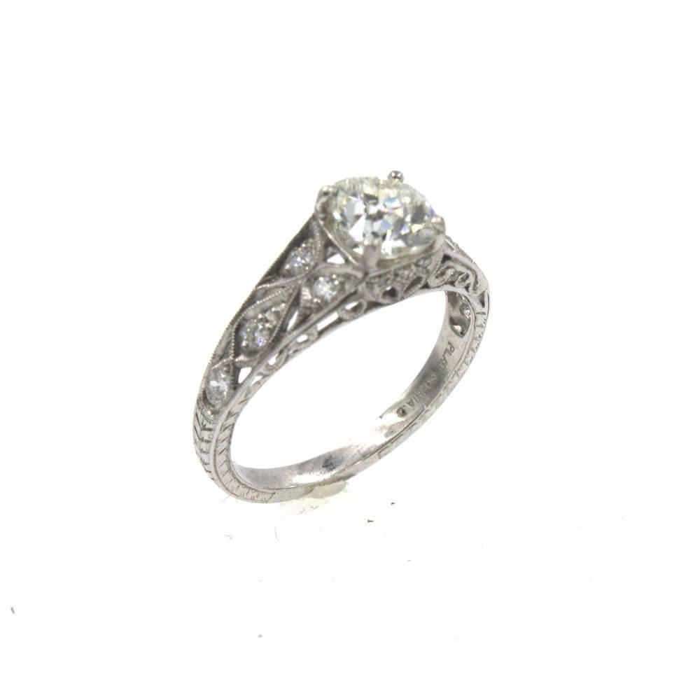 This gorgeous platinum diamond engagement ring features a 1.21 carat Old European Cut Diamond with GIA certificate. The diamond is graded K color and VS2 clarity. The filigree diamond mounting has an old world look, but has been made in more modern