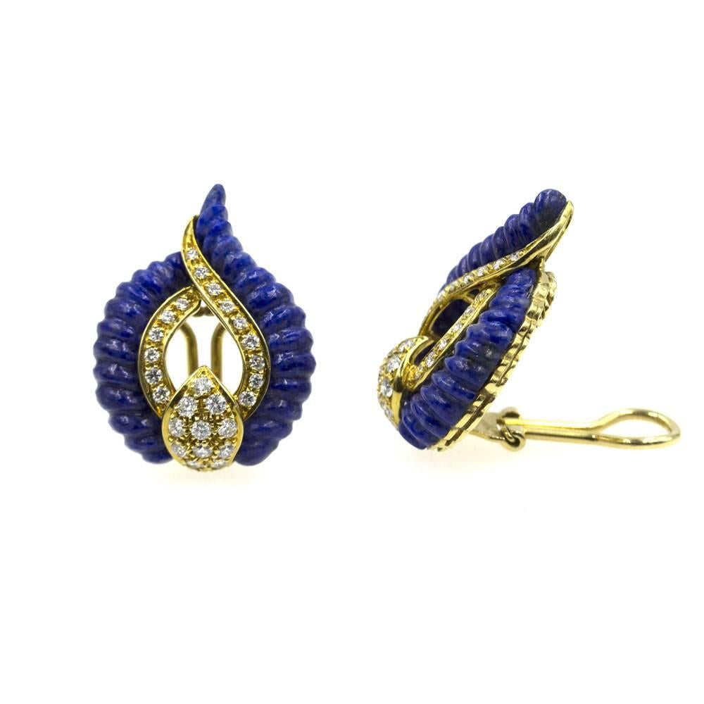 These fabulous vintage earrings feature diamonds and carved lapis crafted in 18 karat yellow gold. The onion dome shaped earrings feature clip-on backs. There are 56 round brilliant cut diamonds that equal approximately 1.25 cttw. The diamonds are