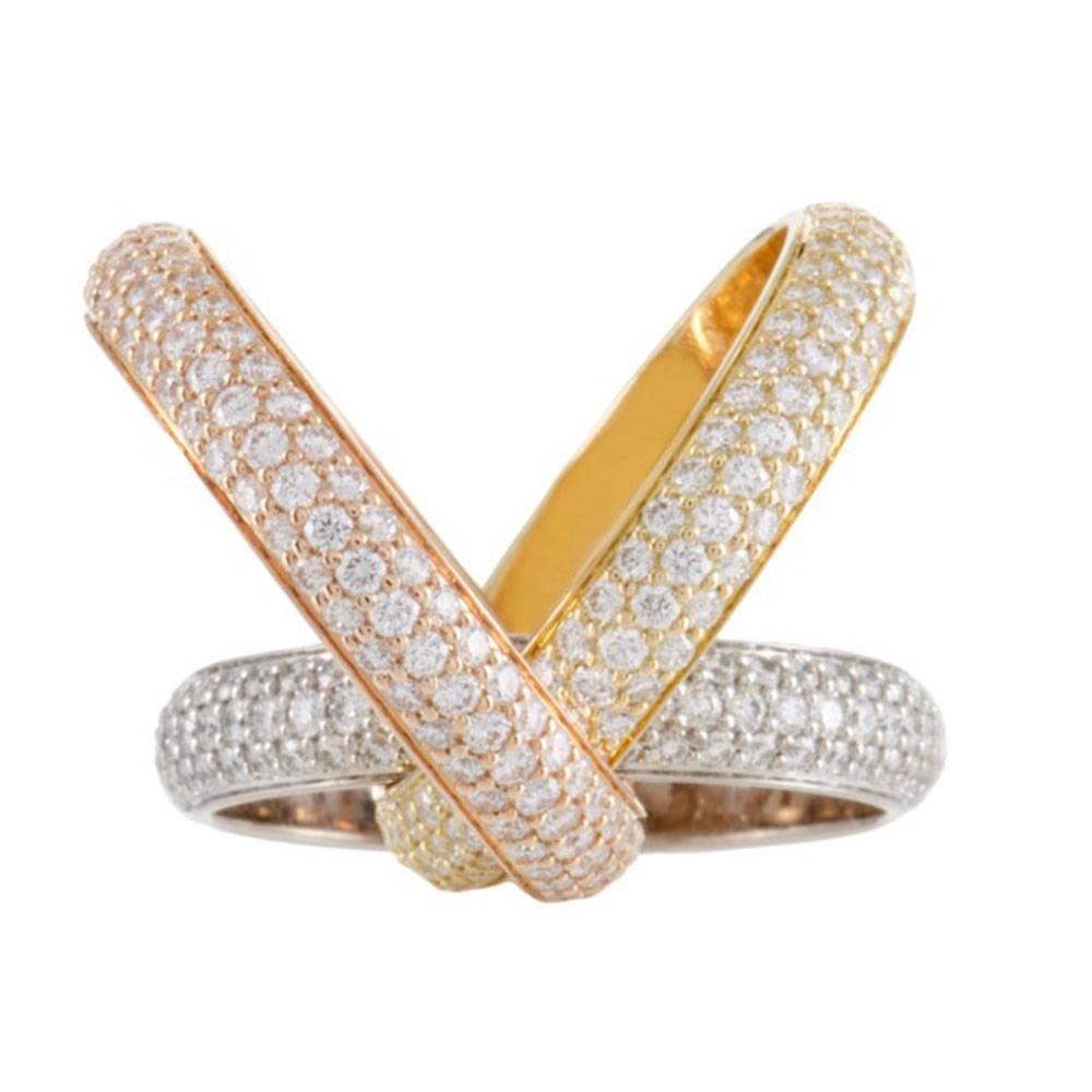 This stunning Cartier Trinity Pave Diamond Band is fashioned in 18 karat yellow, white, and rose gold. Each band is set with diamonds equaling approximately 3.00 cttw. The diamonds are graded E/F color and VS clarity. The ring is size 6 (51), and