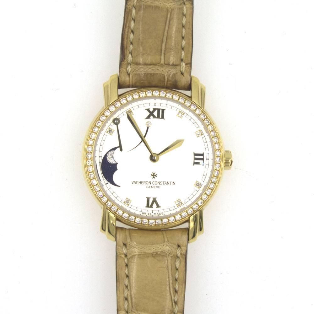 Vacheron Constantin 32mm Ladies Watch. The 18 karat yellow gold watch features power reserve, diamond bezel, moon phase, manual wind, and leather strap.  Box and papers included. Style number 83500. Excellent Condition. All watches come with a 1