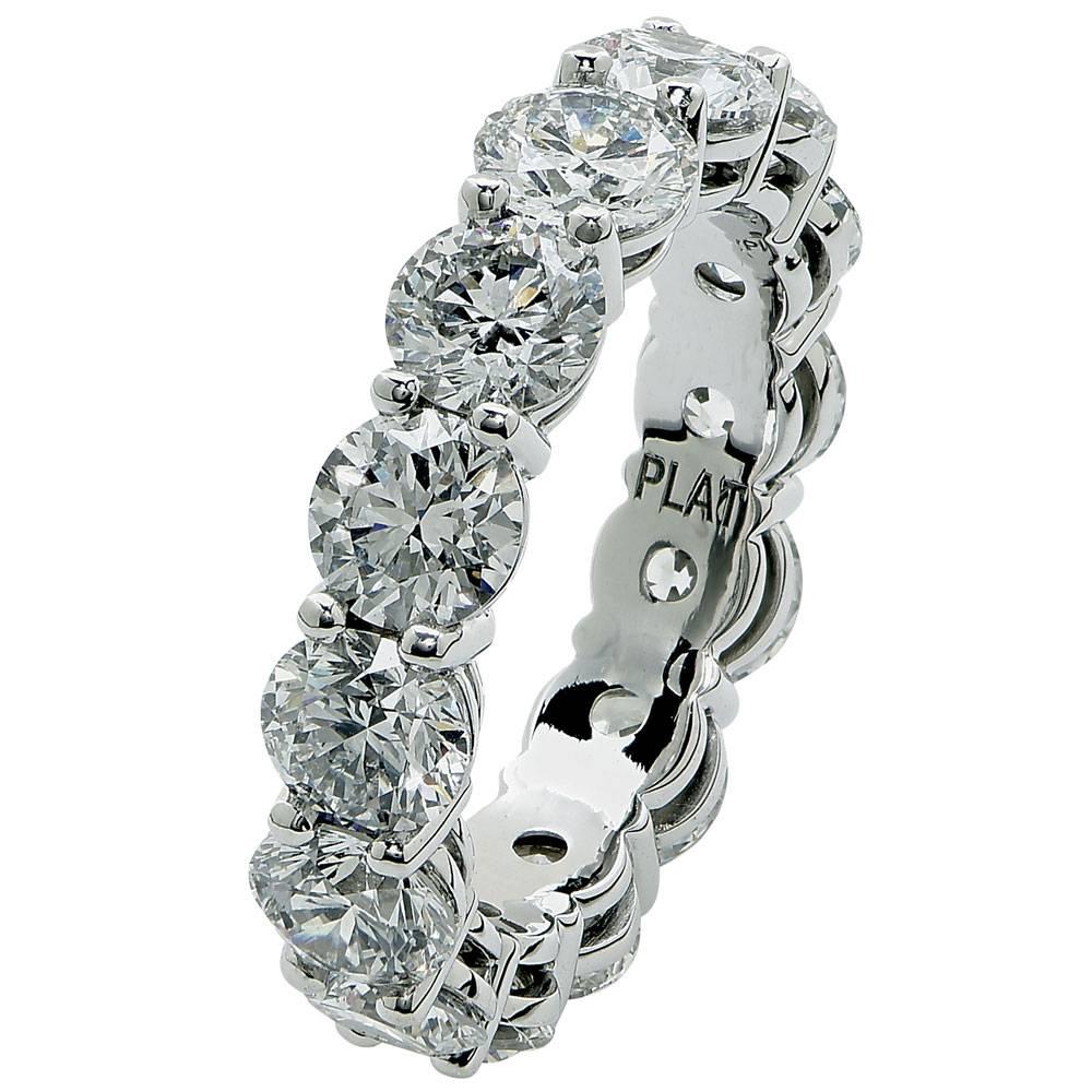 Exquisite Fourteen Diamond Platinum Eternity Band. This beautifully crafted eternity band features 5.89 carats of round brilliant cut diamonds graded D-F color and VS2-SI2 clarity. Each of the fourteen diamonds has its own GIA certificate. The ring