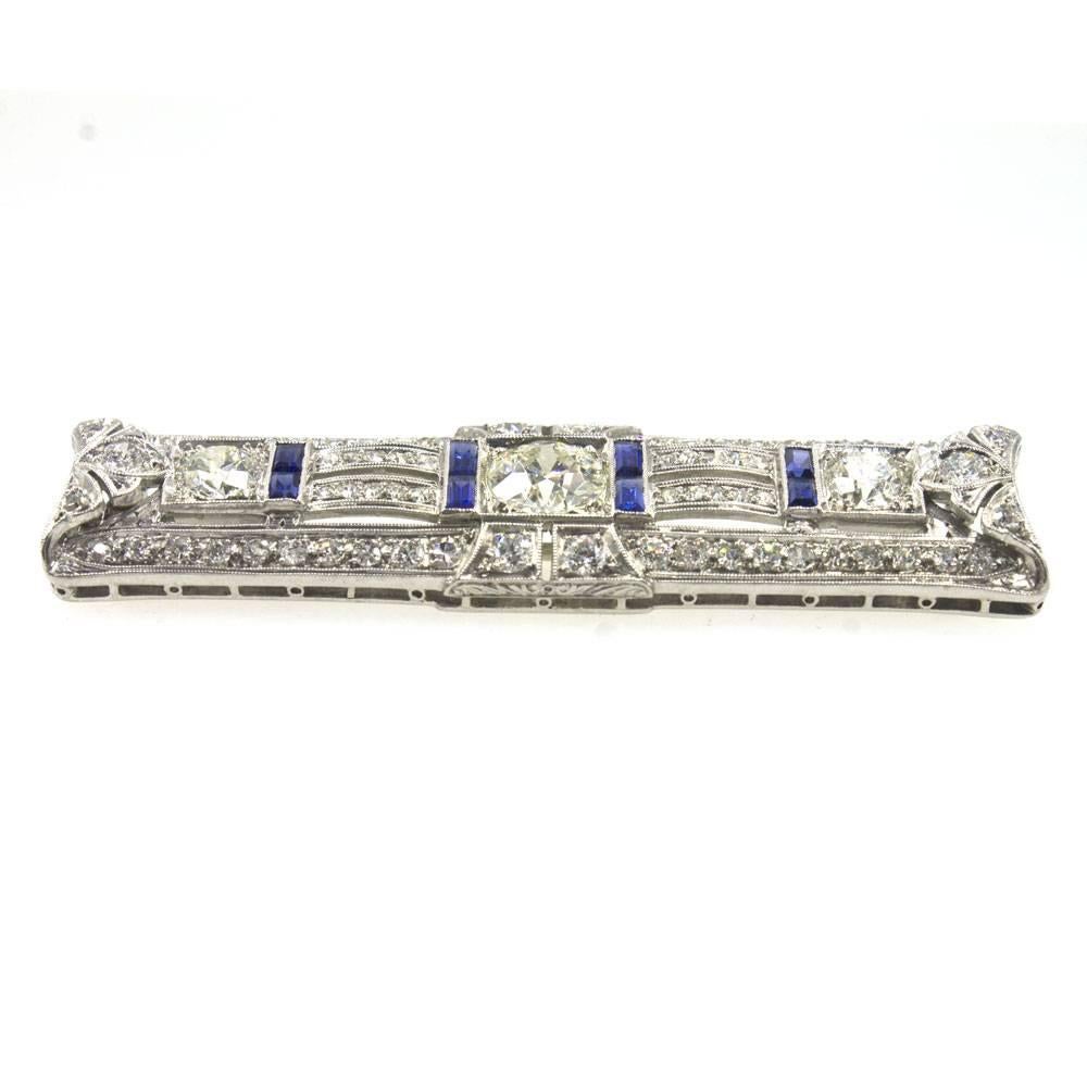 Original Art Deco Diamond and Sapphire Pin/Brooch. This gorgeous platinum pin features a center Old European Cut diamond that weighs approximately 1.28 carat total weight. The center diamonds is graded I color and SI clarity. There are another 1.68