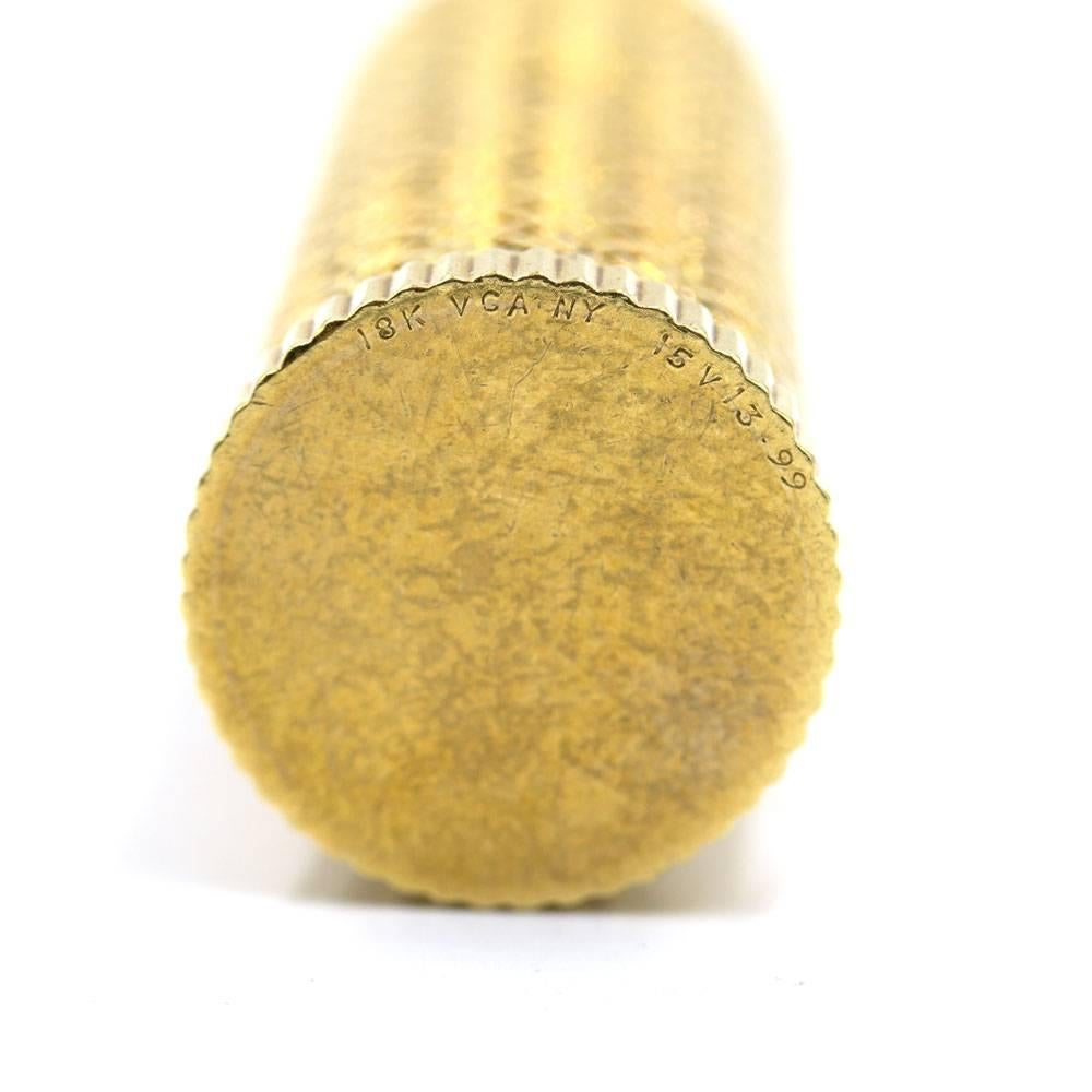 Vintage Van Cleef 18 Karat Yellow Gold Lipstick Case. The case features a textured basket weave pattern, measures 2.2 inches in length, and .75 inches in width. On the bottom, the case is signed 18k VCA NY and numbered.  