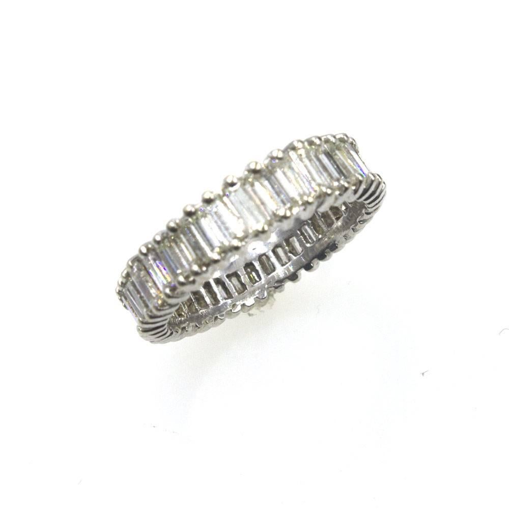 Gorgeous baguette cut diamond eternity band. This platinum estate band features approximately 2.00 carats of baguette cut diamonds. The diamonds are graded I-J color and SI clarity. The band is size 6, tapers 4-5mm in width, and weighs 3.3 grams. 