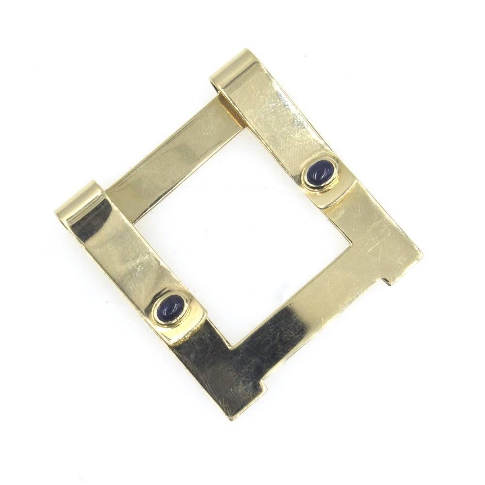 1960's Cartier money clip in 14 karat yellow gold. The clip features two cabochon sapphires and measures 45 x 45mm. 
Hallmarked and stamped 14k Cartier. 