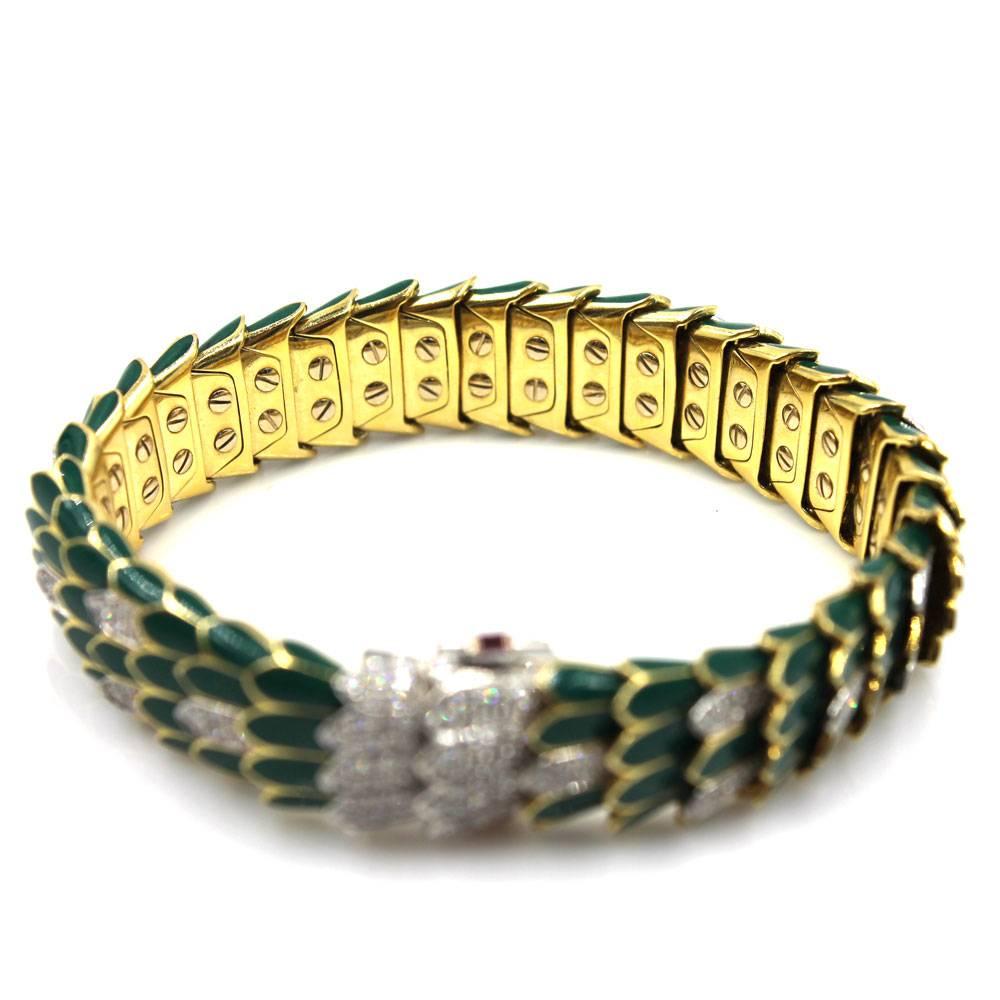 Roberto Coin diamond and green enamel snake skin bracelet from the Animalier collection. This gorgeous bracelet is crafted in two tone 18 karat gold, and the scales are fashioned in green enamel and diamonds. There are 1.97 carat total weight of