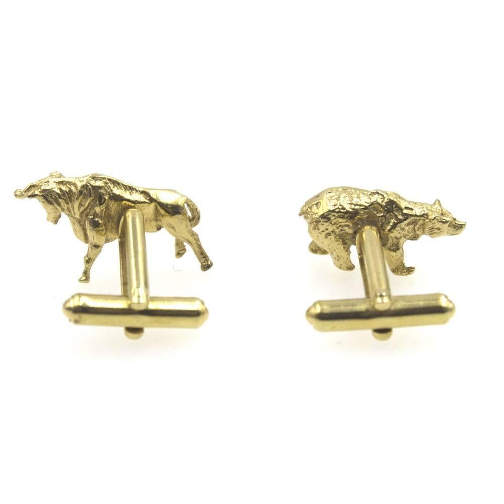 These cufflinks are a great gift for the business man in your life. Financially themed bull and bear cufflinks are crafted in solid 14 karat yellow gold. They measure between .75-1.0 inches in length. 