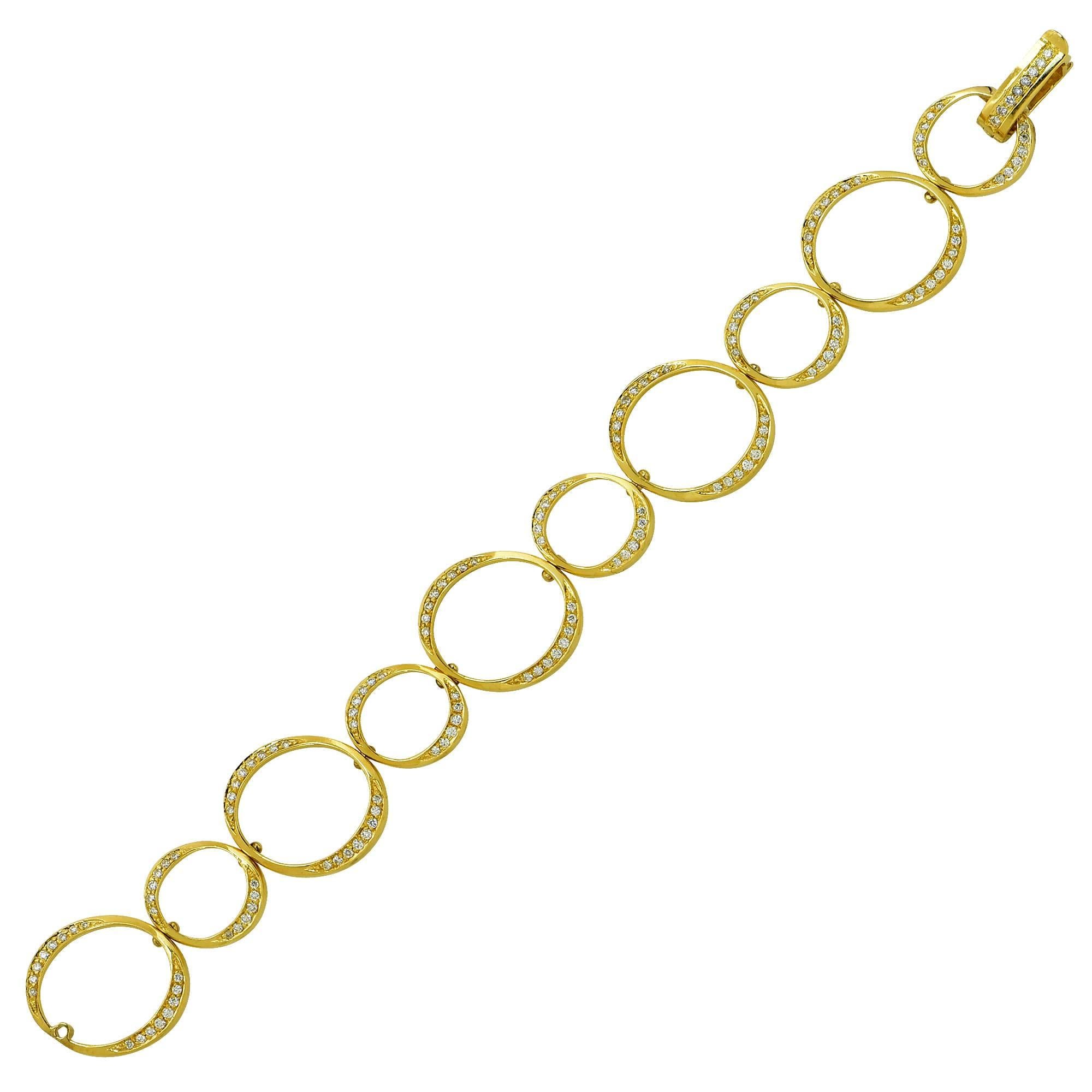 This feminine diamond link bracelet is fashioned in 18 karat yellow gold. The open round links feature 148 round brilliant cut diamonds that weigh approximately 2.03 carat total weight. The bracelet measures 7.5 inches in length and .80 inches in