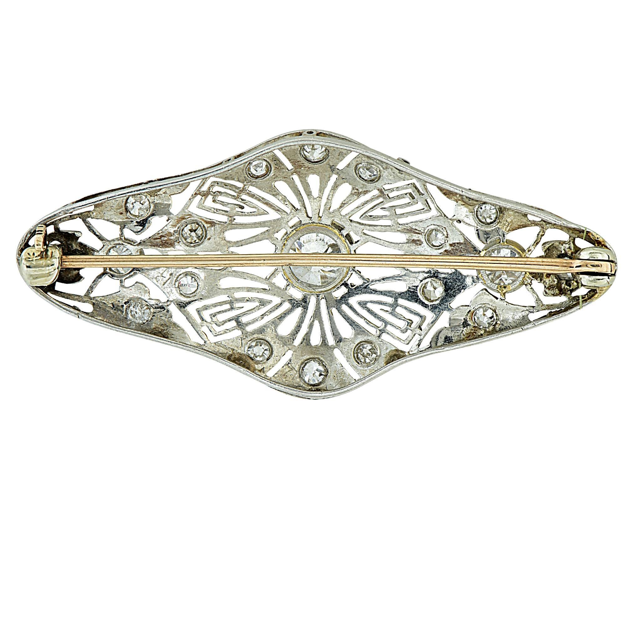 This beautiful Art Deco diamond pin features 23 Old European Cut diamonds that equal approximately 1.75 carat total weight. The brooch is crafted in platinum, and weighs 6.4 grams. 