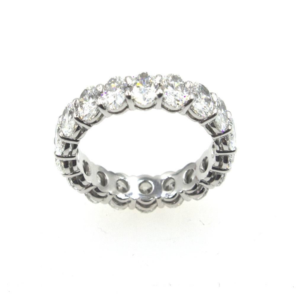 Beautiful oval diamond eternity band fashioned in platinum. The 18 oval brilliant cut diamonds are graded G color and VS clarity. The ring is size 6.25, and features 4.47 carat total weight of diamonds. 