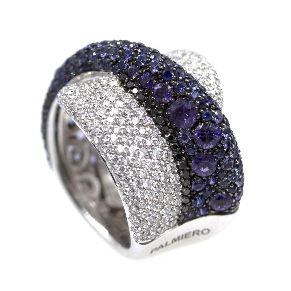 This stunning sapphire and diamond ring was fashioned by Italian designer Palmiero. Brilliant diamonds, deep blue sapphires, and a few amethyst are blended together in a crossover fashion. There are approximately 4 carat total weight of diamonds.