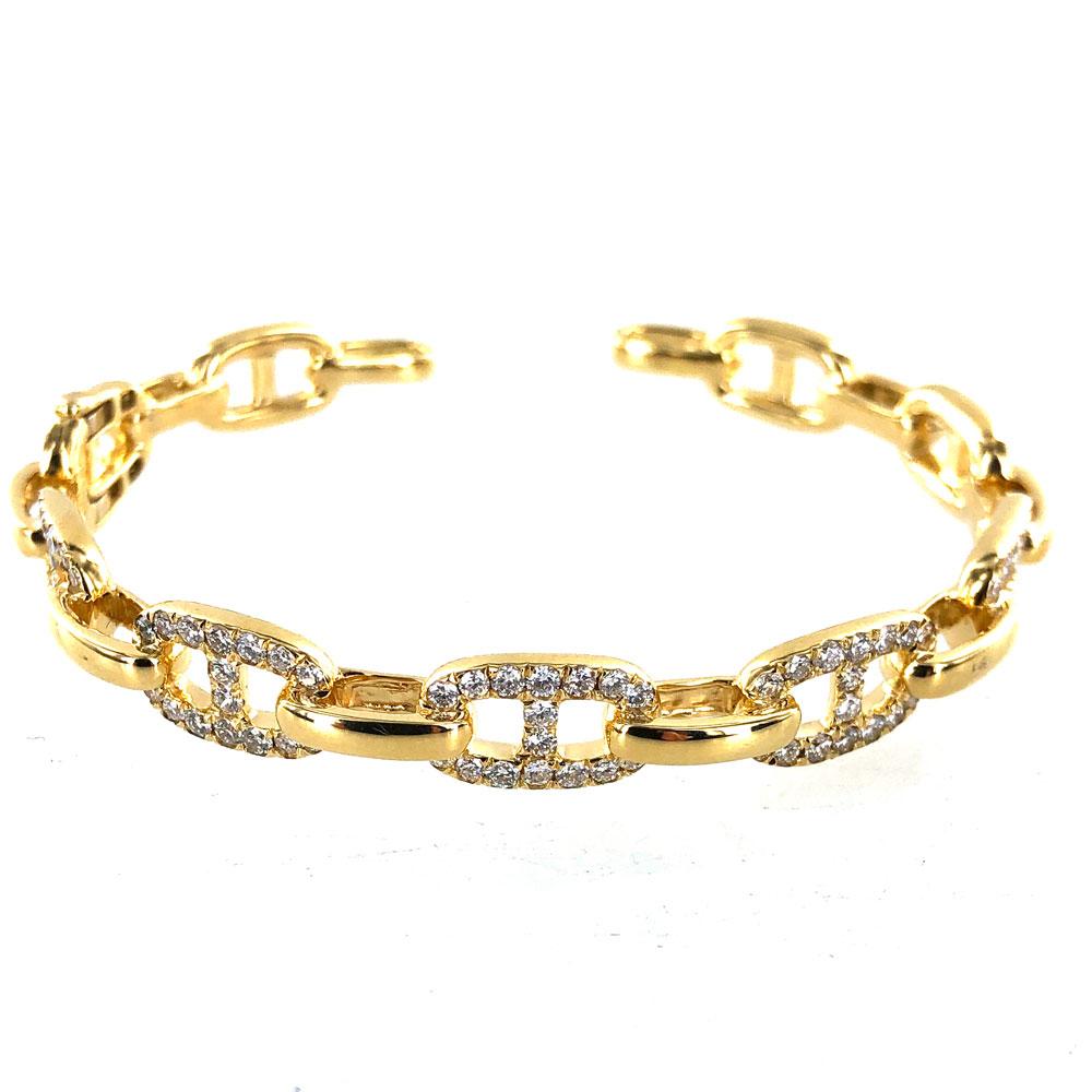 Sparkling and stylish diamond anchor link hinged cuff bracelet. The cuff is crafted in 18 karat yellow gold solid links, and features 2.00 carat total weight of white round brilliant cut diamonds graded GHI color and SI 1-2 clarity. The bracelet