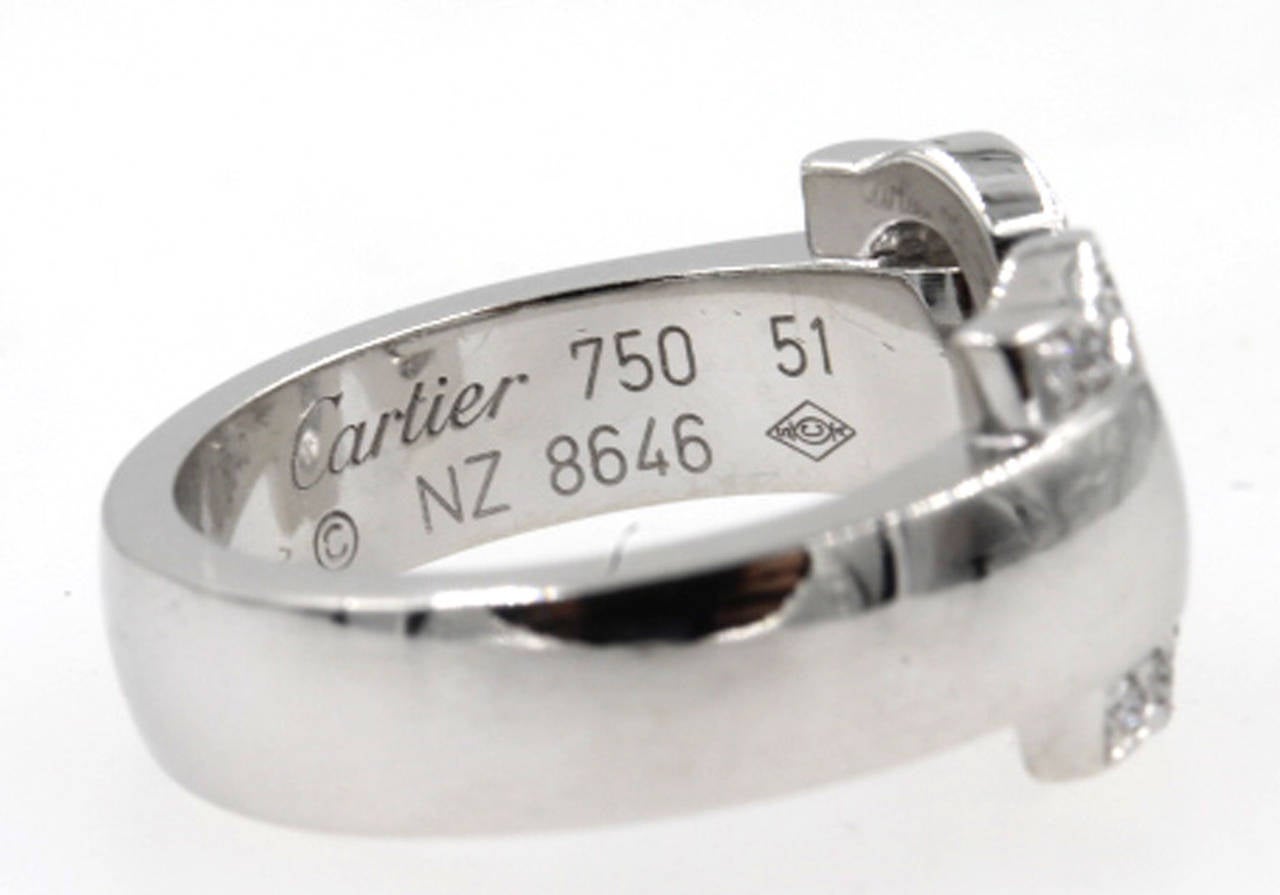 This 18 Karat white gold and diamond double C Cartier ring is from Cartier's 