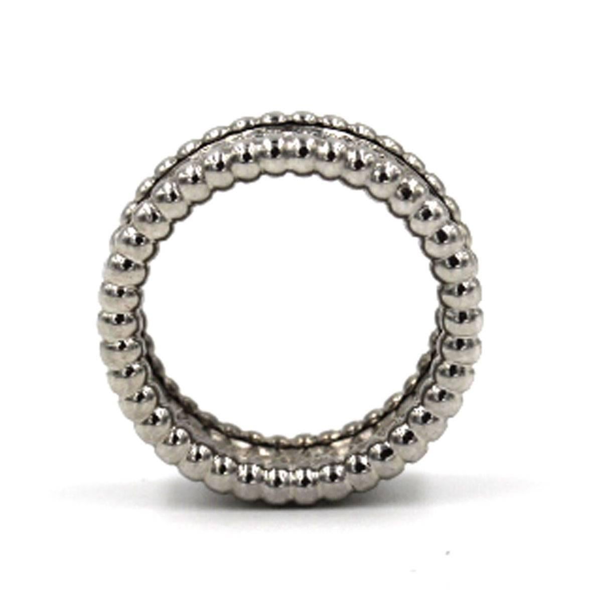 This timeless diamond eternity band from designer Van Cleef & Arpels is part of the Perlee collection.  The ring is size 52 (US size 6), signed VCA, and numbered JB388349.  Retail price is $15,500.