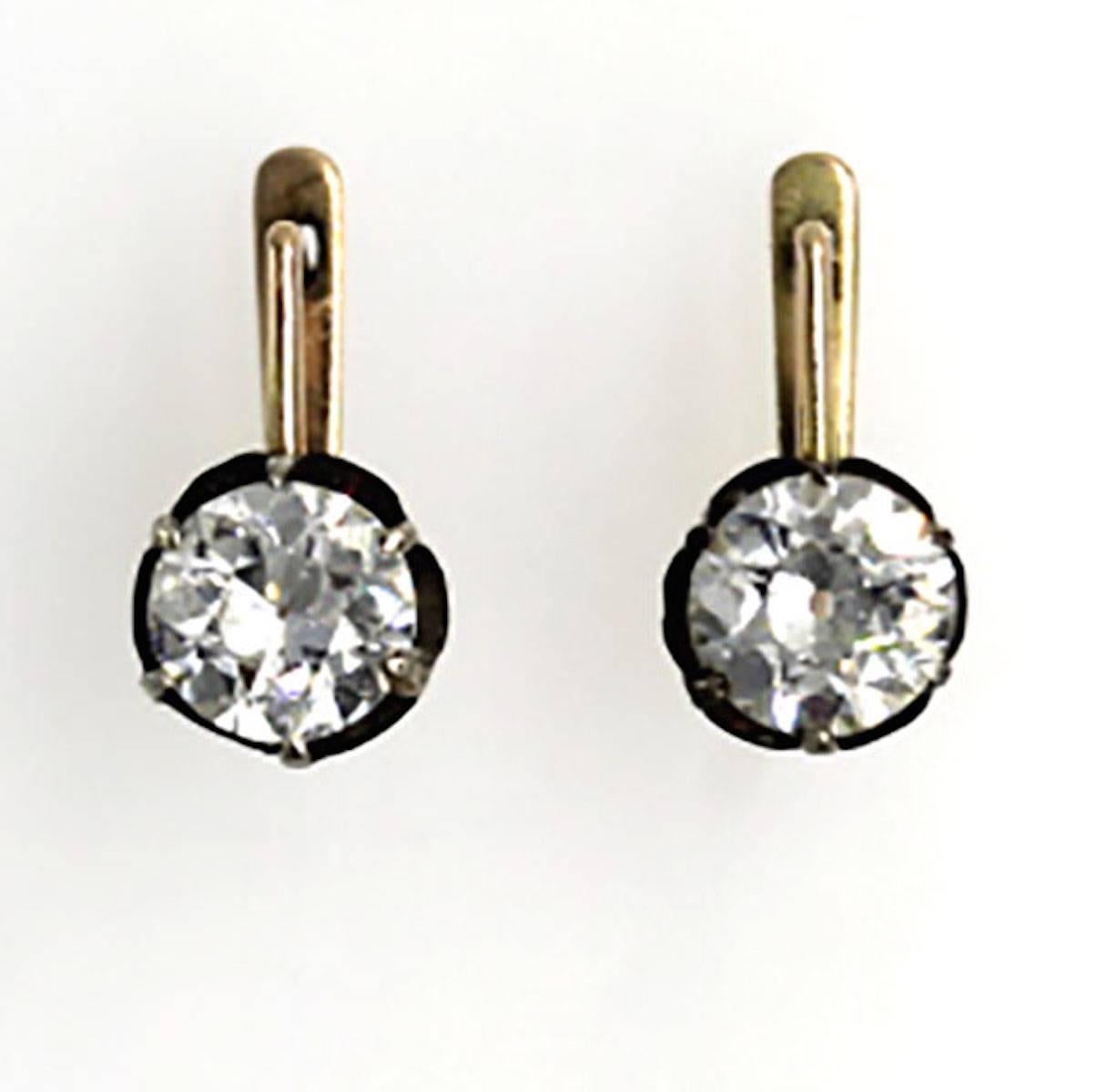 These rare and original diamond earrings from the Victorian Era feature two Old European Cut diamonds equaling 3.14 carat total weight. The diamonds are well matched and are approximately N color, and SI1 clarity. A silver piping surrounds the