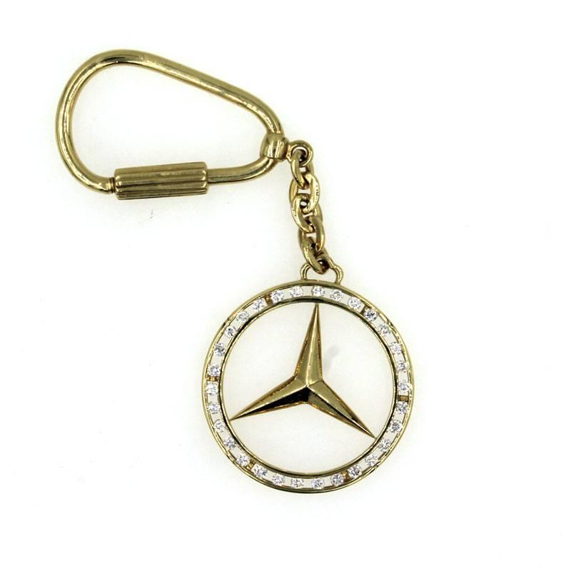  Mercedes emblem keychain features 30 round brilliant cut diamonds that are set into 18 karat yellow gold. The keychain hangs 4 inches, and is a perfect gift for the car lover in your life. 

