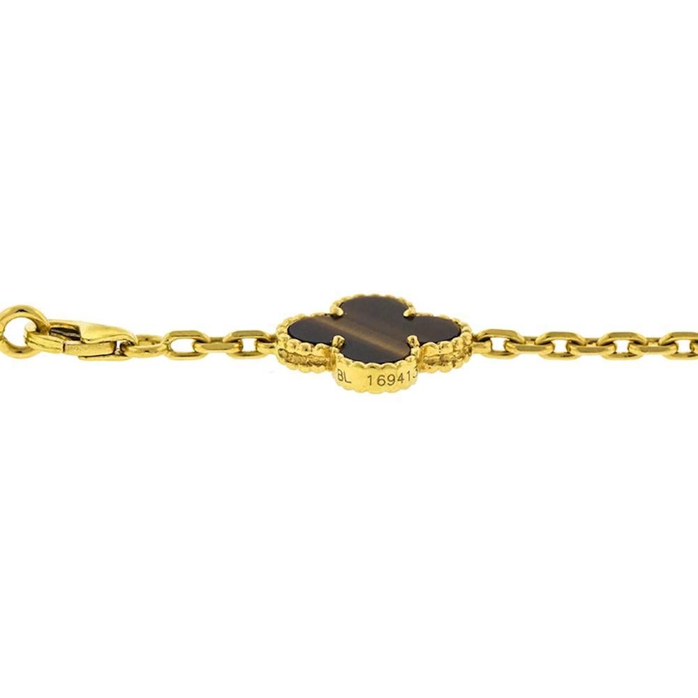 Gorgeous Van Cleef & Arpels Vintage Alhambra necklace features 20 stations of Tiger’s Eye clovers set in 18 karat yellow gold. This popular 33 inch necklace can be worn long or doubled up. Signed VCA 750 and numbered. Comes in a VCA pouch. The
