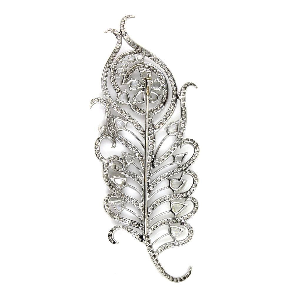 This fabulous estate pin features 10 carats of rose cut and round brilliant cut diamonds. The 318 diamonds are graded G-H color and VS2-SI1 clarity. The leaf shaped pin measures 4 inches in length and 1.7 inches in width. 