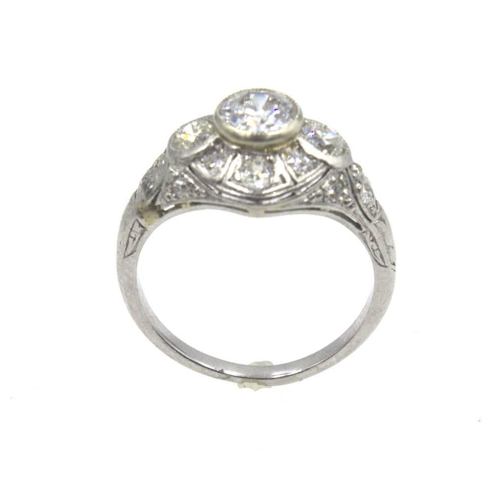 Gorgeous Art Deco Diamond Platinum Engagement Ring. This Deco ring from the early 1900's features all Old European Cut diamonds. In the center is a .70 carat diamond that is graded I color and SI clarity. There are another .70 carats of side