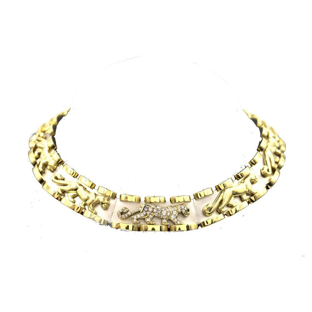 Make a statement with this stunning diamond panther choker necklace.  The polished 18 karat yellow gold and satin finished 14 karat white gold links measure 16.75 inches in length. The diamond panther, which is detachable, can be worn as a pin and