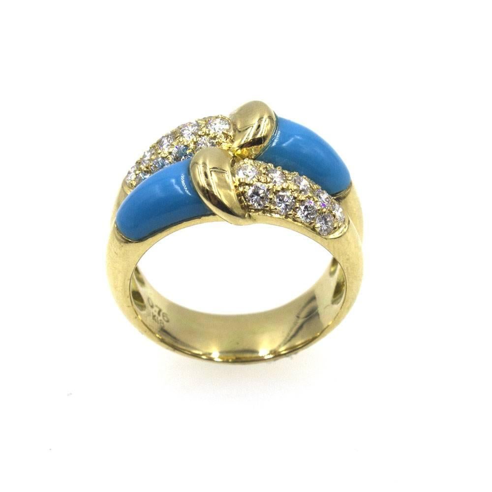 Turquoise and diamonds blend great together in this 18 karat yellow gold ring. The two row band features 26 round brilliant cut diamonds that equal approximately .75 carat total weight. The band measures .60 inches in width, and currently size 7.5,