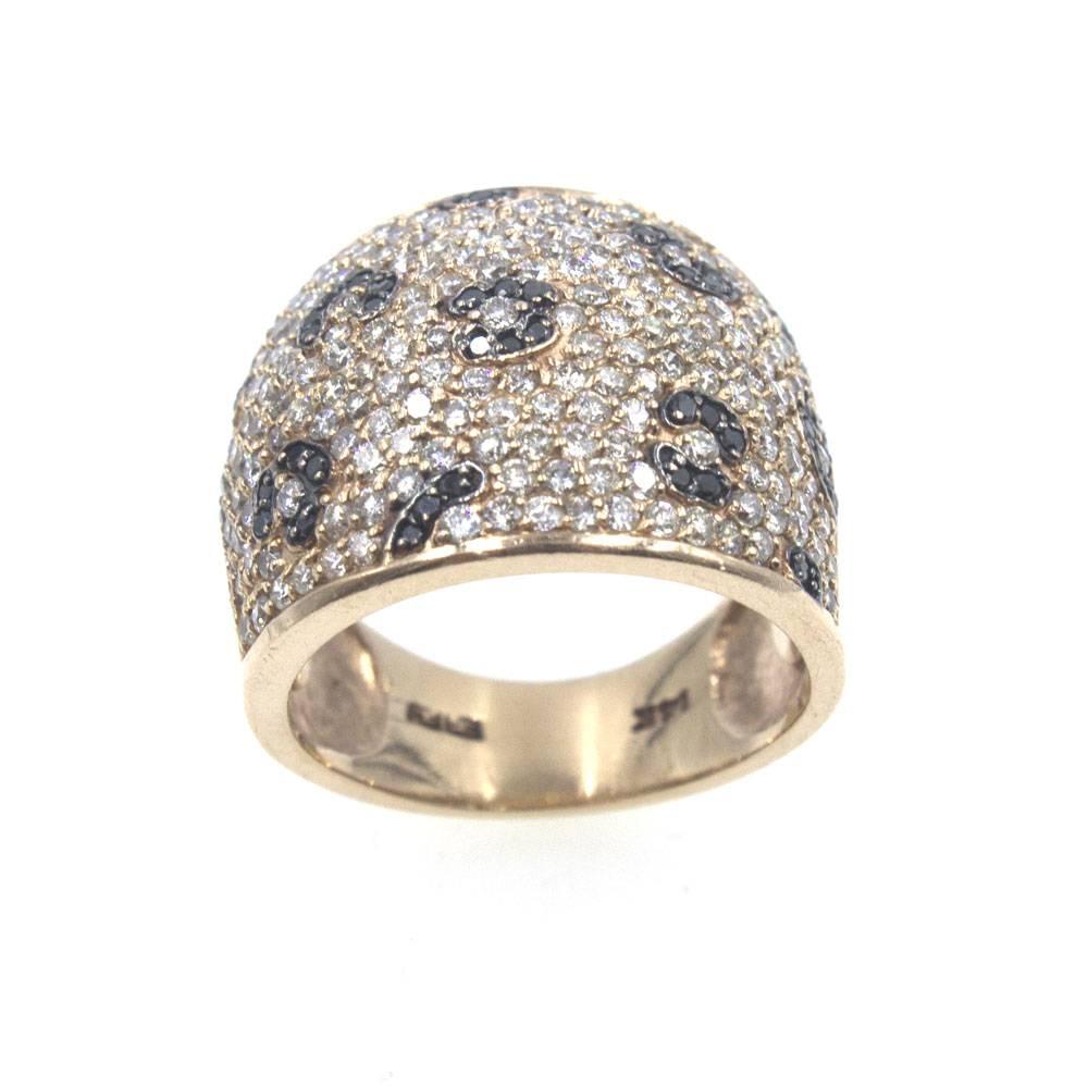 This stylish rose gold band is fashioned with white and black diamonds. The black diamonds are crafted into small flowers that contrast against the white diamond background. There are approximately 2.00 carat total weight of diamonds. The ring is